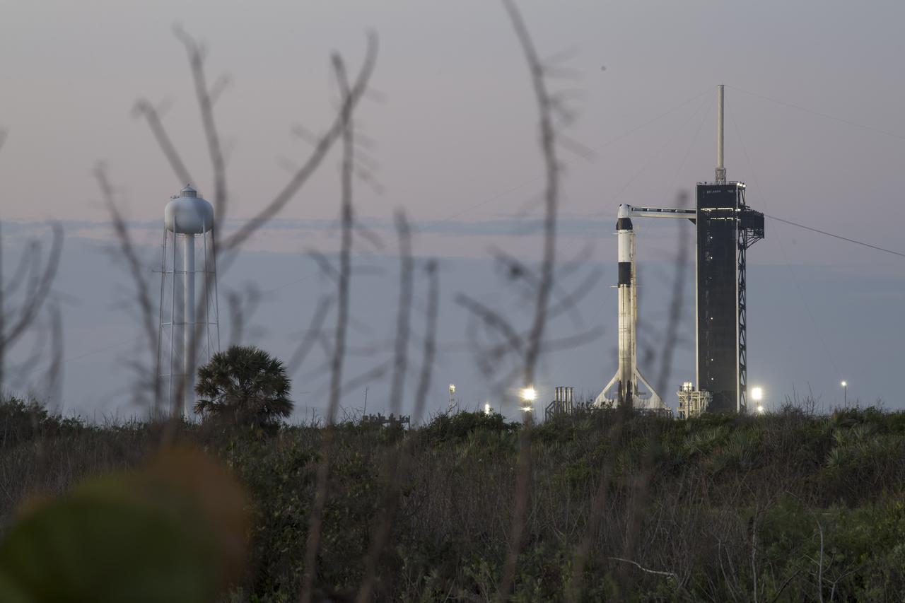A SpaceX Falcon 9 rocket with the company's Crew Dragon spacecraft onboard is seen at sunrise on the launch pad at Launch Complex 39A as preparations continue for the Crew-2 mission, Thursday, April 22, 2021, at NASA’s Kennedy Space Center in Florida. NASA’s SpaceX Crew-2 mission is the second crew rotation mission of the SpaceX Crew Dragon spacecraft and Falcon 9 rocket to the International Space Station as part of the agency’s Commercial Crew Program. NASA astronauts Shane Kimbrough and Megan McArthur, ESA (European Space Agency) astronaut Thomas Pesquet, and Japan Aerospace Exploration Agency (JAXA) astronaut Akihiko Hoshide are scheduled to launch at 5:49 a.m. EDT on Friday, April 23, from Launch Complex 39A at the Kennedy Space Center. Photo Credit: (NASA/Aubrey Gemignani)