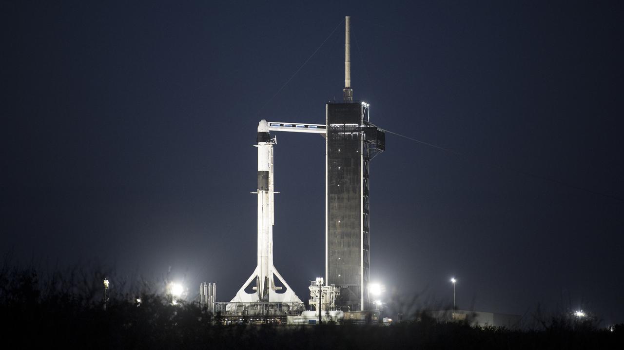 A SpaceX Falcon 9 rocket with the company's Crew Dragon spacecraft onboard is seen on the launch pad at Launch Complex 39A before sunrise as preparations continue for the Crew-2 mission, Thursday, April 22, 2021, at NASA’s Kennedy Space Center in Florida. NASA’s SpaceX Crew-2 mission is the second crew rotation mission of the SpaceX Crew Dragon spacecraft and Falcon 9 rocket to the International Space Station as part of the agency’s Commercial Crew Program. NASA astronauts Shane Kimbrough and Megan McArthur, ESA (European Space Agency) astronaut Thomas Pesquet, and Japan Aerospace Exploration Agency (JAXA) astronaut Akihiko Hoshide are scheduled to launch at 5:49 a.m. EDT on Friday, April 23, from Launch Complex 39A at the Kennedy Space Center. Photo Credit: (NASA/Joel Kowsky)