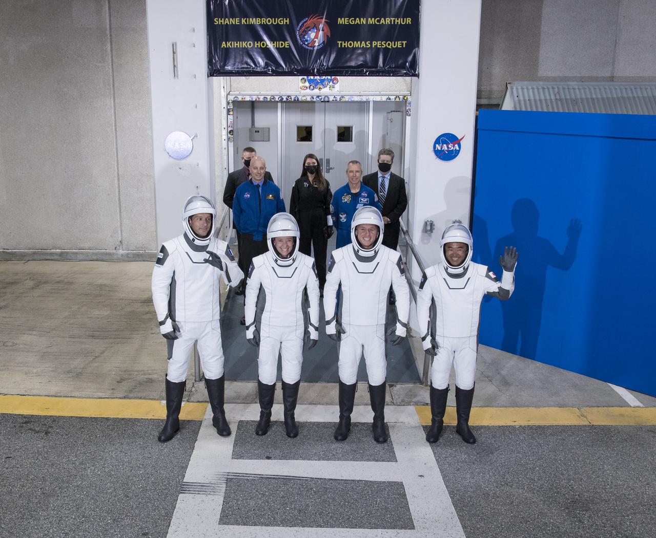 From left to right, ESA (European Space Agency) astronaut Thomas Pesquet, NASA astronauts Megan McArthur and Shane Kimbrough, and Japan Aerospace Exploration Agency (JAXA) astronaut Akihiko Hoshide, wearing SpaceX spacesuits, are seen as they prepare to depart the Neil  A. Armstrong Operations and Checkout Building for Launch Complex 39A to board the SpaceX Crew Dragon spacecraft for the Crew-2 mission launch, Friday, April 23, 2021, at NASA’s Kennedy Space Center in Florida. NASA’s SpaceX Crew-2 mission is the second crew rotation mission of the SpaceX Crew Dragon spacecraft and Falcon 9 rocket to the International Space Station as part of the agency’s Commercial Crew Program. Kimbrough, McArthur, Pesquet, and Hoshide are scheduled to launch at 5:49 a.m. EDT.  Photo Credit: (NASA/Aubrey Gemignani)
