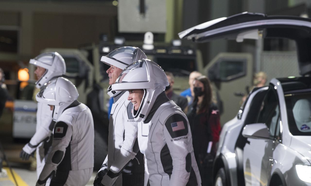 From left to right, ESA (European Space Agency) astronaut Thomas Pesquet, Japan Aerospace Exploration Agency (JAXA) astronaut Akihiko Hoshide, and NASA astronauts Shane Kimbrough and Megan McArthur, are seen as they prepare to depart the Neil  A. Armstrong Operations and Checkout Building for Launch Complex 39A to board the SpaceX Crew Dragon spacecraft for the Crew-2 mission launch, Friday, April 23, 2021, at NASA’s Kennedy Space Center in Florida. NASA’s SpaceX Crew-2 mission is the second crew rotation mission of the SpaceX Crew Dragon spacecraft and Falcon 9 rocket to the International Space Station as part of the agency’s Commercial Crew Program. Kimbrough, McArthur, Pesquet, and Hoshide are scheduled to launch at 5:49 a.m. EDT. Photo Credit: (NASA/Aubrey Gemignani)