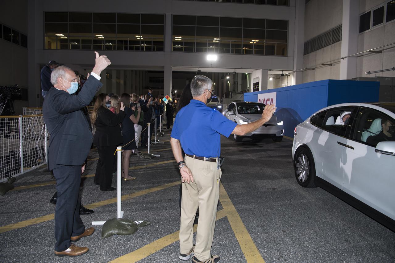 Acting NASA Administrator Steve Jurczyk gives a thumbs up to NASA astronauts Shane Kimbrough and Megan McArthur, ESA (European Space Agency) astronaut Thomas Pesquet, and Japan Aerospace Exploration Agency (JAXA) astronaut Akihiko Hoshide, as they depart the Neil  A. Armstrong Operations and Checkout Building for Launch Complex 39A to board the SpaceX Crew Dragon spacecraft for the Crew-2 mission launch, Friday, April 23, 2021, at NASA’s Kennedy Space Center in Florida. NASA’s SpaceX Crew-2 mission is the second crew rotation mission of the SpaceX Crew Dragon spacecraft and Falcon 9 rocket to the International Space Station as part of the agency’s Commercial Crew Program. Kimbrough, McArthur, Pesquet, and Hoshide are scheduled to launch at 5:49 a.m. EDT on Friday, April 23, from Launch Complex 39A at the Kennedy Space Center.  Photo Credit: (NASA/Aubrey Gemignani)
