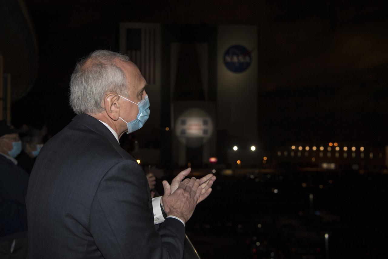 Acting NASA Administrator Steve Jurczyk claps as he watches the launch of a SpaceX Falcon 9 rocket carrying the company's Crew Dragon spacecraft on NASA’s SpaceX Crew-2 mission with NASA astronauts Shane Kimbrough and Megan McArthur, ESA (European Space Agency) astronaut Thomas Pesquet, and Japan Aerospace Exploration Agency (JAXA) astronaut Akihiko Hoshide onboard, Friday, April 23, 2021, from the balcony of  Operations Support Building II at NASA’s Kennedy Space Center in Florida. NASA’s SpaceX Crew-2 mission is the first crew rotation mission of the SpaceX Crew Dragon spacecraft and Falcon 9 rocket to the International Space Station as part of the agency’s Commercial Crew Program. Kimbrough, McArthur, Pesquet, and Hoshide launched at 5:49 a.m. EDT from Launch Complex 39A at the Kennedy Space Center to begin a six month mission onboard the orbital outpost. Photo Credit: (NASA/Aubrey Gemignani)