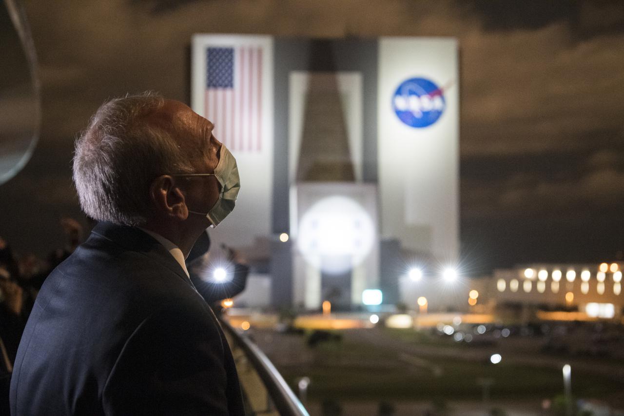 Acting NASA Administrator Steve Jurczyk watches the launch of a SpaceX Falcon 9 rocket carrying the company's Crew Dragon spacecraft on NASA’s SpaceX Crew-2 mission with NASA astronauts Shane Kimbrough and Megan McArthur, ESA (European Space Agency) astronaut Thomas Pesquet, and Japan Aerospace Exploration Agency (JAXA) astronaut Akihiko Hoshide onboard, Friday, April 23, 2021, from the balcony of Operations Support Building II at NASA’s Kennedy Space Center in Florida. NASA’s SpaceX Crew-2 mission is the first crew rotation mission of the SpaceX Crew Dragon spacecraft and Falcon 9 rocket to the International Space Station as part of the agency’s Commercial Crew Program. Kimbrough, McArthur, Pesquet, and Hoshide launched at 5:49 a.m. EDT from Launch Complex 39A at the Kennedy Space Center to begin a six month mission onboard the orbital outpost. Photo Credit: (NASA/Aubrey Gemignani)
