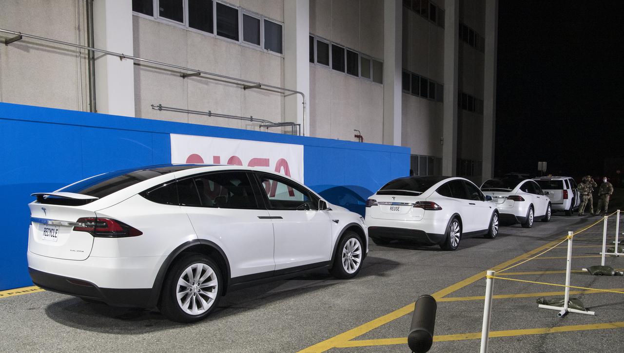 The vehicles that will carry NASA astronauts Shane Kimbrough and Megan McArthur, ESA (European Space Agency) astronaut Thomas Pesquet, and Japan Aerospace Exploration Agency (JAXA) astronaut Akihiko Hoshide, to Launch Complex 39A to board the SpaceX Crew Dragon spacecraft for the Crew-2 mission launch to the International Space Station, are seen as they prepare to depart the Neil  A. Armstrong Operations and Checkout Building, Friday, April 23, 2021, at NASA’s Kennedy Space Center in Florida. The license plates read "Reduce," "Reuse," and "Recycle." Kimbrough, McArthur, Pesquet, and Hoshide launched at 5:49 a.m. EDT from Launch Complex 39A. Photo Credit: (NASA/Aubrey Gemignani)