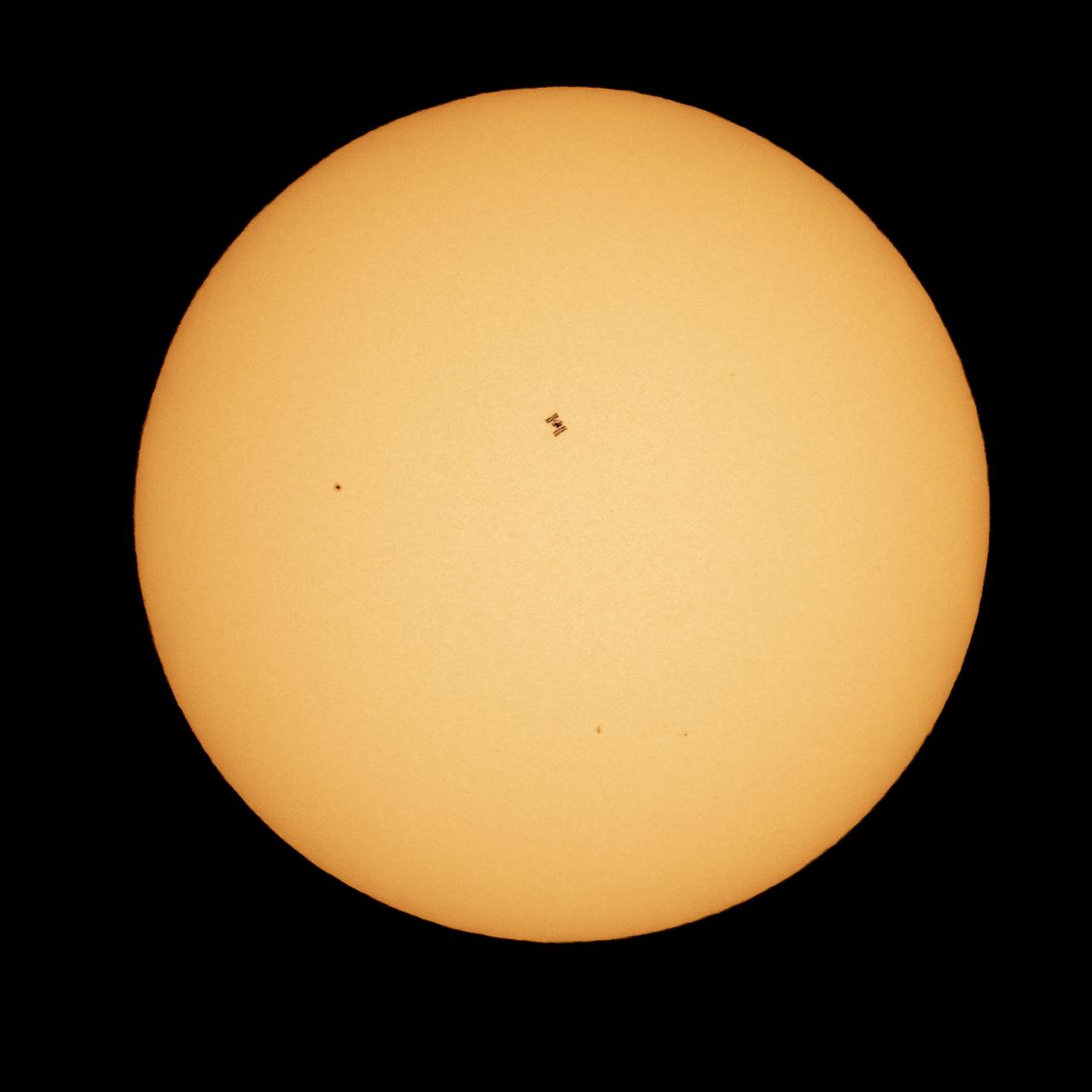 The International Space Station, with a crew of seven aboard, is seen in silhouette as it transits the sun at roughly five miles per second, Friday, April 23, 2021, as seen from Nottingham, Maryland. Aboard are: NASA astronauts Shannon Walker, Mike Hopkins, Victor Glover, Mark Vande Hei; Roscosmos cosmonauts Oleg Novitskiy, Pyotr Dubrov; and Japan Aerospace Exploration Agency (JAXA) astronaut Soichi Noguchi. Joining the crew aboard station tomorrow will be Crew-2 mission crew members: NASA astronauts Shane Kimbrough and Megan McArthur, JAXA astronaut Akihiko Hoshide, and ESA (European Space Agency) astronaut Thomas Pesquet. Photo Credit: (NASA/Bill Ingalls)