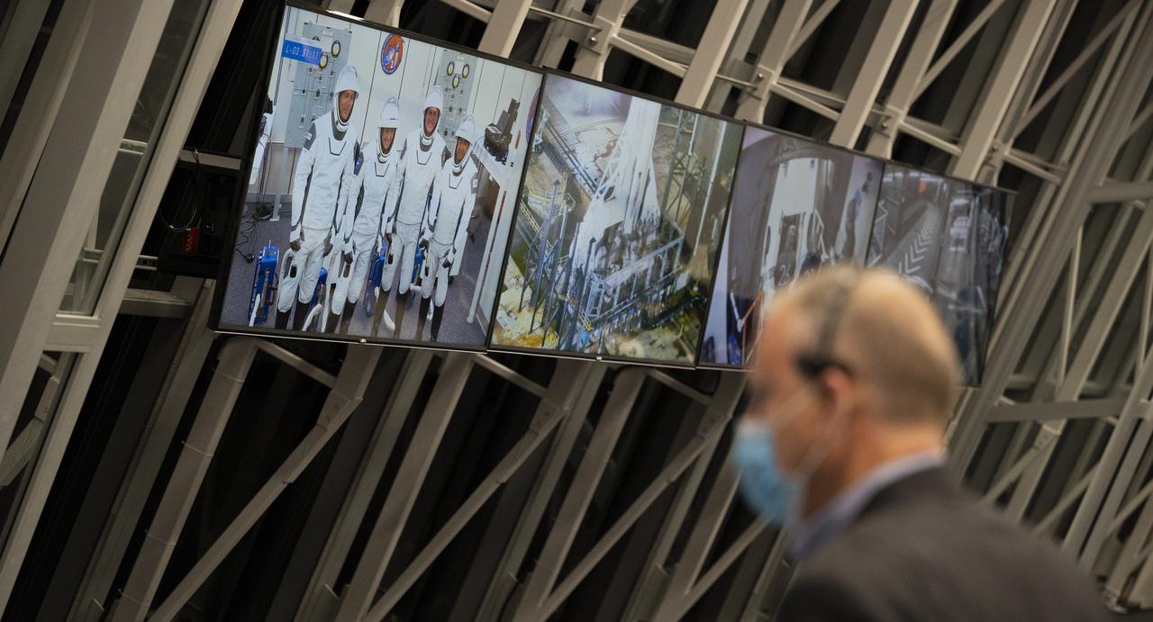 NASA astronauts Shane Kimbrough and Megan McArthur, ESA (European Space Agency) astronaut Thomas Pesquet, and Japan Aerospace Exploration Agency (JAXA) astronaut Akihiko Hoshide are seen on a monitor inside firing room four of the Launch Control Center as NASA and SpaceX teams monitor the countdown, Friday, April 23, 2021, at NASA’s Kennedy Space Center in Florida. NASA’s SpaceX Crew-2 mission is the second crew rotation mission of the SpaceX Crew Dragon spacecraft and Falcon 9 rocket to the International Space Station as part of the agency’s Commercial Crew Program. Kimbrough, McArthur, Pesquet, and Hoshide launched at 5:49 a.m. EDT, from Launch Complex 39A at the Kennedy Space Center. Photo Credit: (NASA/Joel Kowsky)