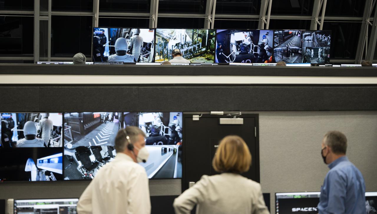 Steve Stich, manager of NASA’s Commercial Crew Program, left, Kathy Lueders, associate administrator for NASA's Human Exploration and Operations Mission Directorate, center, and Phil McAlister, NASA’s director of commercial spaceflight, watch as NASA astronauts Shane Kimbrough and Megan McArthur are seen on monitors as they prepare to board SpaceX’s Crew Dragon spacecraft for launch, Friday, April 23, 2021, in firing room four of the Launch Control Center at NASA’s Kennedy Space Center in Florida. NASA’s SpaceX Crew-2 mission is the second crew rotation mission of the SpaceX Crew Dragon spacecraft and Falcon 9 rocket to the International Space Station as part of the agency’s Commercial Crew Program. Kimbrough, McArthur, ESA (European Space Agency) astronaut Thomas Pesquet, and Japan Aerospace Exploration Agency (JAXA) astronaut Akihiko Hoshide launched at 5:49 a.m. EDT, from Launch Complex 39A at the Kennedy Space Center. Photo Credit: (NASA/Joel Kowsky)
