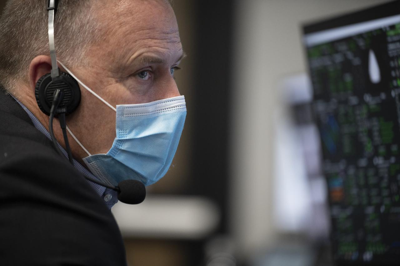 Norm Knight, deputy director of Flight Operations at NASA's Johnson Space Center, monitors the countdown of the launch of a SpaceX Falcon 9 rocket carrying the company's Crew Dragon spacecraft on NASA’s SpaceX Crew-2 mission with NASA astronauts Shane Kimbrough and Megan McArthur, ESA (European Space Agency) astronaut Thomas Pesquet, and Japan Aerospace Exploration Agency (JAXA) astronaut Akihiko Hoshide onboard, Friday, April 23, 2021, in firing room four of the Launch Control Center at NASA’s Kennedy Space Center in Florida. NASA’s SpaceX Crew-2 mission is the second crew rotation mission of the SpaceX Crew Dragon spacecraft and Falcon 9 rocket to the International Space Station as part of the agency’s Commercial Crew Program. Kimbrough, McArthur, Pesquet, and Hoshide launched at 5:49 a.m. EDT, from Launch Complex 39A at the Kennedy Space Center. Photo Credit: (NASA/Joel Kowsky)
