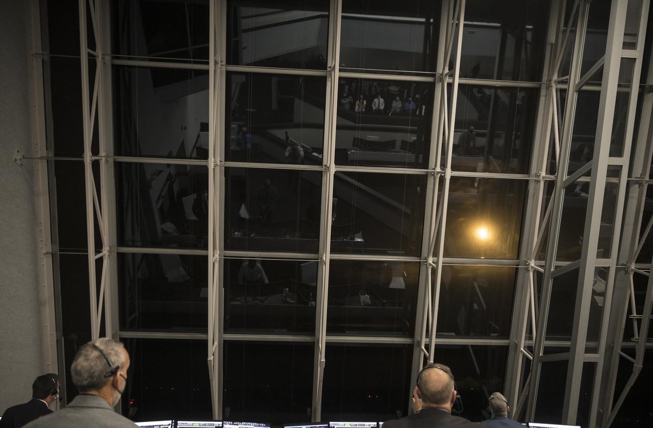 NASA and SpaceX launch teams monitor the launch of a SpaceX Falcon 9 rocket carrying the company's Crew Dragon spacecraft on the Crew-2 mission with NASA astronauts Shane Kimbrough and Megan McArthur, ESA (European Space Agency) astronaut Thomas Pesquet, and Japan Aerospace Exploration Agency (JAXA) astronaut Akihiko Hoshide onboard, Friday, April 23, 2021, in  firing room four of the Launch Control Center at NASA’s Kennedy Space Center in Florida. NASA’s SpaceX Crew-2 mission is the second crew rotation mission of the SpaceX Crew Dragon spacecraft and Falcon 9 rocket to the International Space Station as part of the agency’s Commercial Crew Program. Kimbrough, McArthur, Pesquet, and Hoshide launched at 5:49 a.m. EDT, from Launch Complex 39A at the Kennedy Space Center. Photo Credit: (NASA/Joel Kowsky)