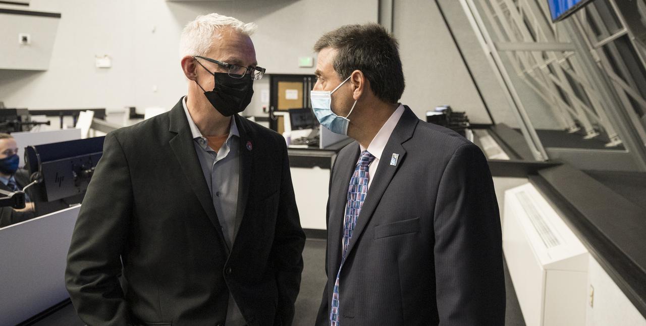 Benji Reed, senior director of Human Spaceflight Programs at SpaceX, left, and NASA International Space Station program manger Joel Montalbano, right, speak following the launch of a SpaceX Falcon 9 rocket carrying the company's Crew Dragon spacecraft on the Crew-2 mission with NASA astronauts Shane Kimbrough and Megan McArthur, ESA (European Space Agency) astronaut Thomas Pesquet, and Japan Aerospace Exploration Agency (JAXA) astronaut Akihiko Hoshide onboard, Friday, April 23, 2021, in  firing room four of the Launch Control Center at NASA’s Kennedy Space Center in Florida. NASA’s SpaceX Crew-2 mission is the second crew rotation mission of the SpaceX Crew Dragon spacecraft and Falcon 9 rocket to the International Space Station as part of the agency’s Commercial Crew Program. Kimbrough, McArthur, Pesquet, and Hoshide launched at 5:49 a.m. EDT, from Launch Complex 39A at the Kennedy Space Center to begin a six month mission onboard the International Space Station. Photo Credit: (NASA/Joel Kowsky)