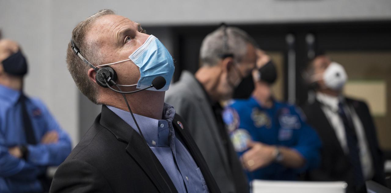 Norm Knight, deputy director of Flight Operations at NASA's Johnson Space Center, monitors the launch of a SpaceX Falcon 9 rocket carrying the company's Crew Dragon spacecraft on the Crew-2 mission with NASA astronauts Shane Kimbrough and Megan McArthur, ESA (European Space Agency) astronaut Thomas Pesquet, and Japan Aerospace Exploration Agency (JAXA) astronaut Akihiko Hoshide onboard, Friday, April 23, 2021, in  firing room four of the Launch Control Center at NASA’s Kennedy Space Center in Florida. NASA’s SpaceX Crew-2 mission is the second crew rotation mission of the SpaceX Crew Dragon spacecraft and Falcon 9 rocket to the International Space Station as part of the agency’s Commercial Crew Program. Kimbrough, McArthur, Pesquet, and Hoshide launched at 5:49 a.m. EDT, from Launch Complex 39A at the Kennedy Space Center. Photo Credit: (NASA/Joel Kowsky)