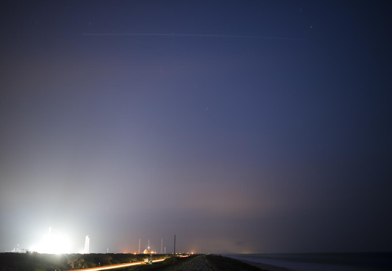 The International Space Station is seen in this one minute exposure as it flies over Launch Complex 39A, Saturday, April 24, 2021, at NASA’s Kennedy Space Center in Florida. The SpaceX Crew Dragon with NASA astronauts Shane Kimbrough and Megan McArthur, ESA (European Space Agency) astronaut Thomas Pesquet, and Japan Aerospace Exploration Agency (JAXA) astronaut Akihiko Hoshide onboard, which launched from Launch Complex 39A at 5:49 a.m. EDT on April 23, docked with the complex at 5:08 a.m. EDT. Kimbrough, McArthur, Pesquet, and Hoshide will join the Expedition 65 crew of Shannon Walker, Michael Hopkins, Victor Glover, and Mark Vande Hei of NASA, Soichi Noguchi of the Japan Aerospace Exploration Agency (JAXA), and Roscosmos cosmonauts Oleg Novitskiy and Pyotr Dubrov onboard the space station. Photo Credit: (NASA/Joel Kowsky)
