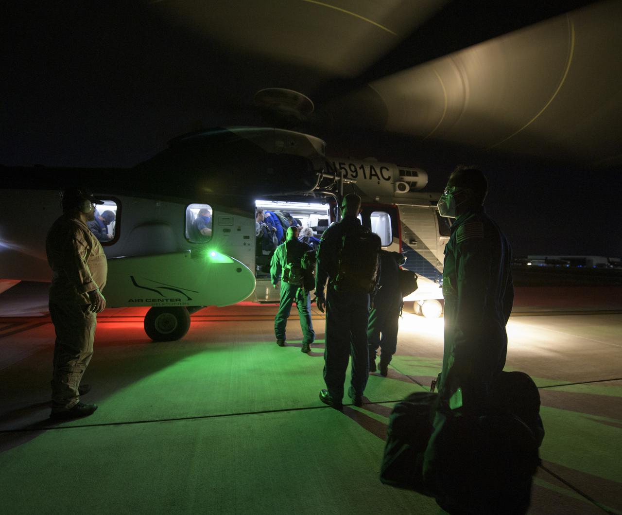 NASA and SpaceX support teams depart from Pensacola, Florida via helicopter to the SpaceX GO Navigator recovery ship to prepare for the landing of the SpaceX Crew Dragon Resilience spacecraft with NASA astronauts Mike Hopkins, Shannon Walker, and Victor Glover, and Japan Aerospace Exploration Agency (JAXA) astronaut Soichi Noguchi aboard in the Gulf of Mexico off the coast of Panama City, Florida, Saturday, May 1, 2021. NASA’s SpaceX Crew-1 mission is the first crew rotation flight of the SpaceX Crew Dragon spacecraft and Falcon 9 rocket with astronauts to the International Space Station as part of the agency’s Commercial Crew Program. Photo Credit: (NASA/Bill Ingalls)
