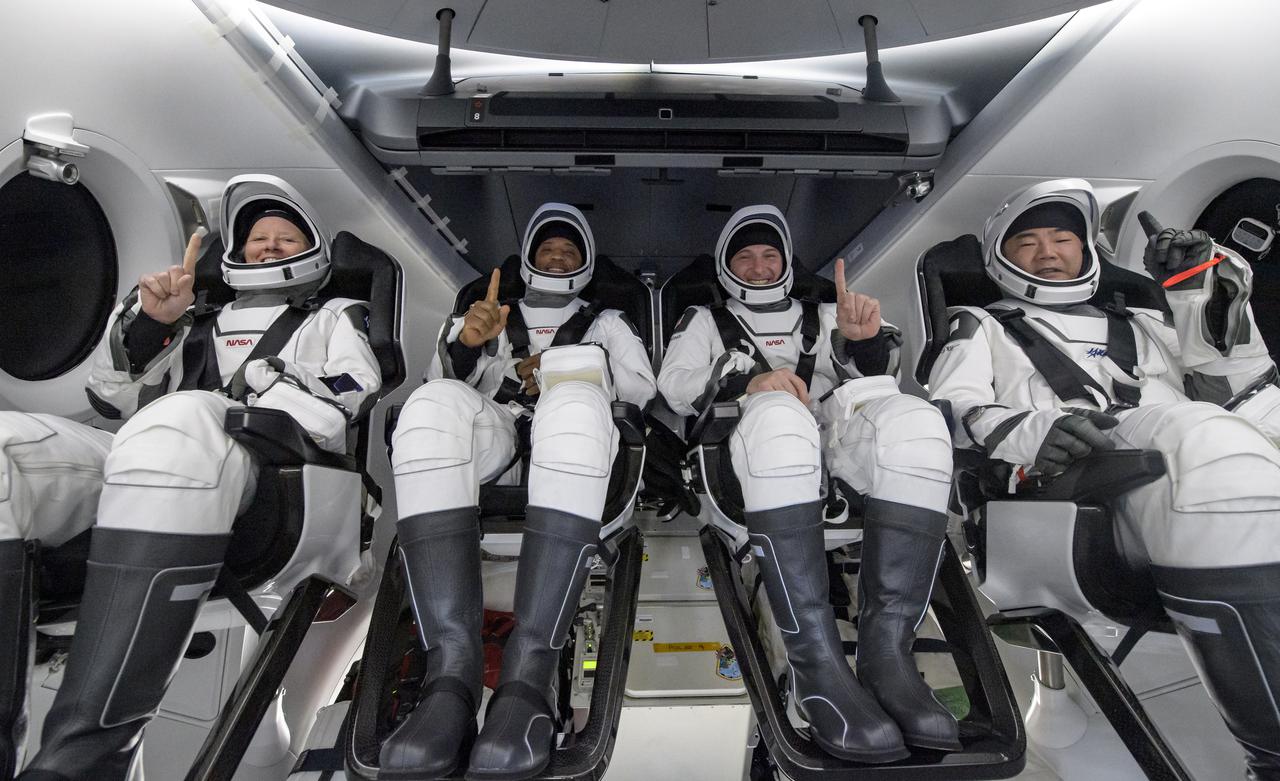 NASA astronauts Shannon Walker, left, Victor Glover, Mike Hopkins, and Japan Aerospace Exploration Agency (JAXA) astronaut Soichi Noguchi, right are seen inside the SpaceX Crew Dragon Resilience spacecraft onboard the SpaceX GO Navigator recovery ship shortly after having landed in the Gulf of Mexico off the coast of Panama City, Florida, Sunday, May 2, 2021.  NASA’s SpaceX Crew-1 mission was the first crew rotation flight of the SpaceX Crew Dragon spacecraft and Falcon 9 rocket with astronauts to the International Space Station as part of the agency’s Commercial Crew Program. Photo Credit: (NASA/Bill Ingalls)