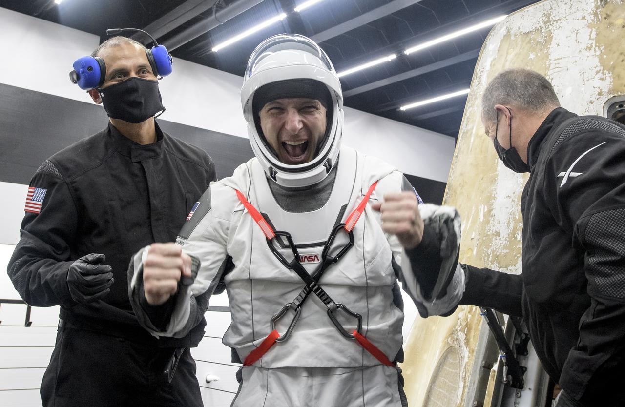 NASA astronaut Mike Hopkins is helped out of the SpaceX Crew Dragon Resilience spacecraft onboard the SpaceX GO Navigator recovery ship after he, NASA astronauts Shannon Walker, Victor Glover and Japan Aerospace Exploration Agency (JAXA) astronaut Soichi Noguchi, landed in the Gulf of Mexico off the coast of Panama City, Florida, Sunday, May 2, 2021. NASA’s SpaceX Crew-1 mission was the first crew rotation flight of the SpaceX Crew Dragon spacecraft and Falcon 9 rocket with astronauts to the International Space Station as part of the agency’s Commercial Crew Program. Photo Credit: (NASA/Bill Ingalls)