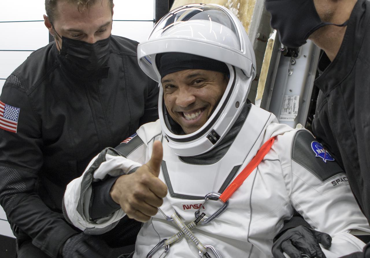 NASA astronaut Victor Glover is helped out of the SpaceX Crew Dragon Resilience spacecraft onboard the SpaceX GO Navigator recovery ship after he, NASA astronauts Mike Hopkins, Shannon Walker, and Japan Aerospace Exploration Agency (JAXA) astronaut Soichi Noguchi, landed in the Gulf of Mexico off the coast of Panama City, Florida, Sunday, May 2, 2021. NASA’s SpaceX Crew-1 mission was the first crew rotation flight of the SpaceX Crew Dragon spacecraft and Falcon 9 rocket with astronauts to the International Space Station as part of the agency’s Commercial Crew Program. Photo Credit: (NASA/Bill Ingalls)