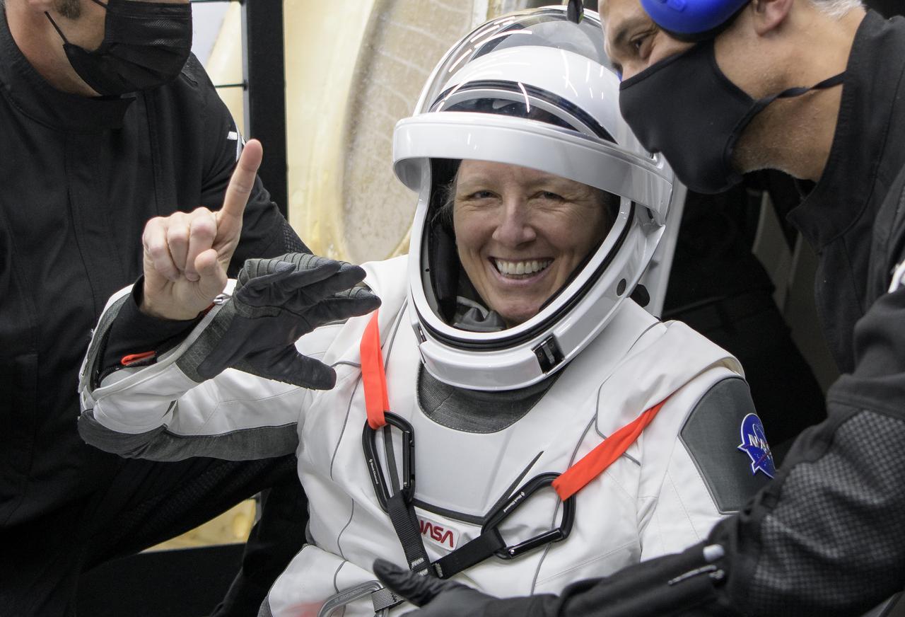 NASA astronaut Shannon Walker is helped out of the SpaceX Crew Dragon Resilience spacecraft onboard the SpaceX GO Navigator recovery ship after she, NASA astronauts Mike Hopkins, Victor Glover, and Japan Aerospace Exploration Agency (JAXA) astronaut Soichi Noguchi, landed in the Gulf of Mexico off the coast of Panama City, Florida, Sunday, May 2, 2021. NASA’s SpaceX Crew-1 mission was the first crew rotation flight of the SpaceX Crew Dragon spacecraft and Falcon 9 rocket with astronauts to the International Space Station as part of the agency’s Commercial Crew Program. Photo Credit: (NASA/Bill Ingalls)