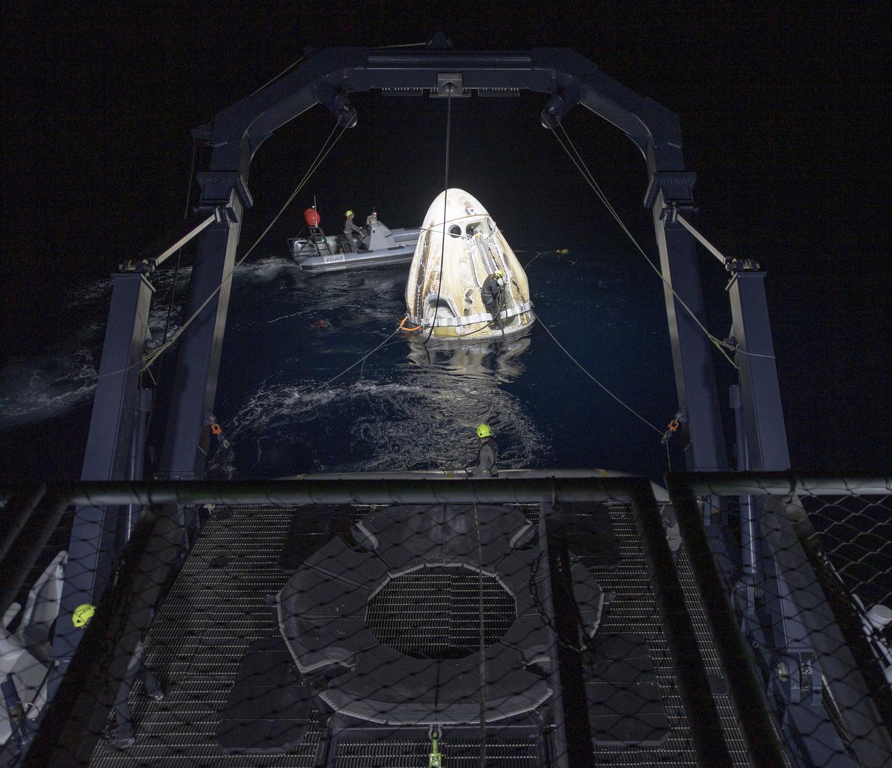 Support teams work around the SpaceX Crew Dragon Resilience spacecraft shortly after it landed with NASA astronauts Mike Hopkins, Shannon Walker, and Victor Glover, and Japan Aerospace Exploration Agency (JAXA) astronaut Soichi Noguchi aboard in the Gulf of Mexico off the coast of Panama City, Florida, Sunday, May 2, 2021.  NASA’s SpaceX Crew-1 mission was the first crew rotation flight of the SpaceX Crew Dragon spacecraft and Falcon 9 rocket with astronauts to the International Space Station as part of the agency’s Commercial Crew Program. Photo Credit: (NASA/Bill Ingalls)