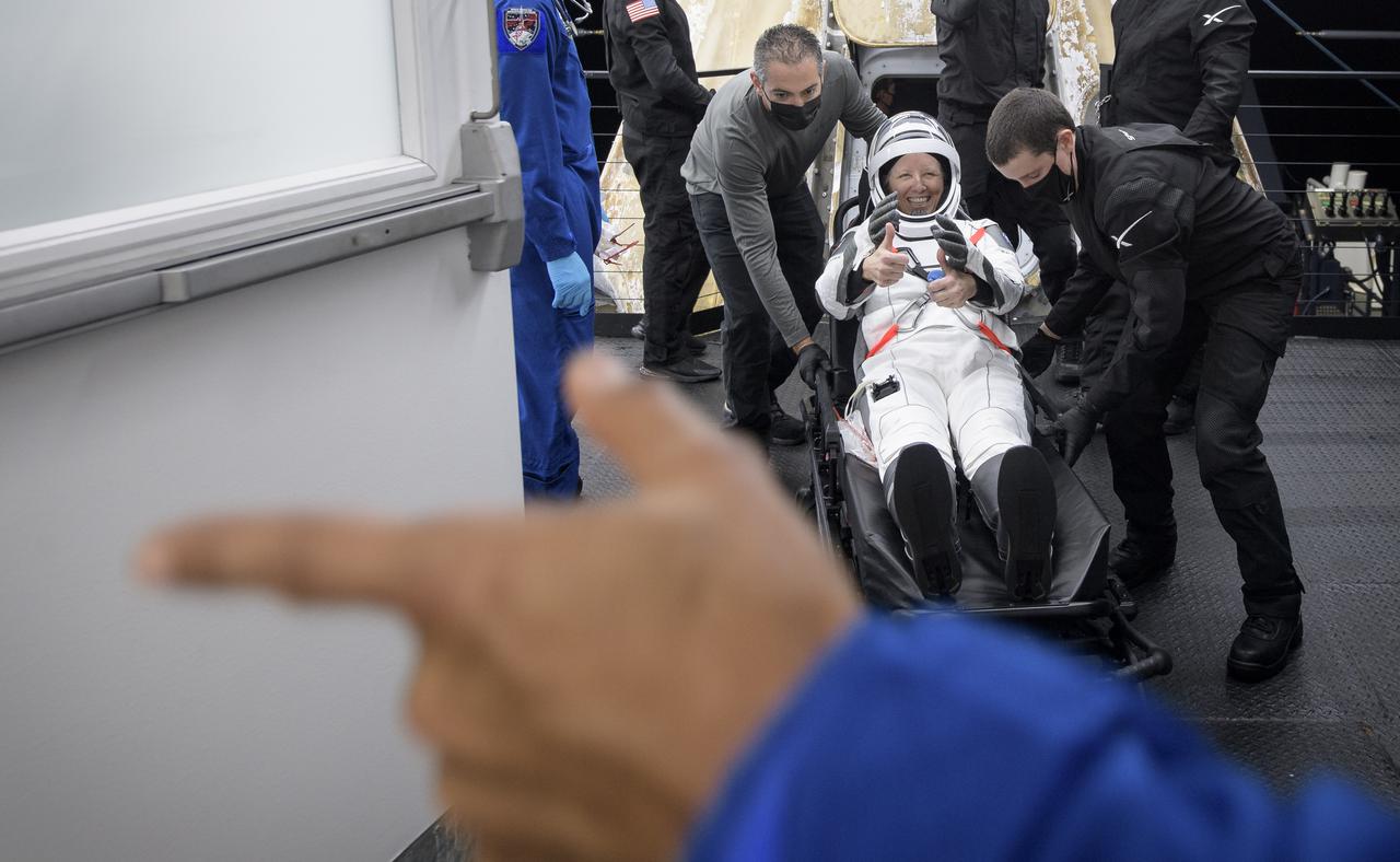 NASA astronaut Shannon Walker smiles and gives a thumbs up after being helped out of the SpaceX Crew Dragon Resilience spacecraft onboard the SpaceX GO Navigator recovery ship after she, NASA astronauts Mike Hopkins, Victor Glover, and Japan Aerospace Exploration Agency (JAXA) astronaut Soichi Noguchi, landed in the Gulf of Mexico off the coast of Panama City, Florida, Sunday, May 2, 2021. NASA’s SpaceX Crew-1 mission was the first crew rotation flight of the SpaceX Crew Dragon spacecraft and Falcon 9 rocket with astronauts to the International Space Station as part of the agency’s Commercial Crew Program. Photo Credit: (NASA/Bill Ingalls)