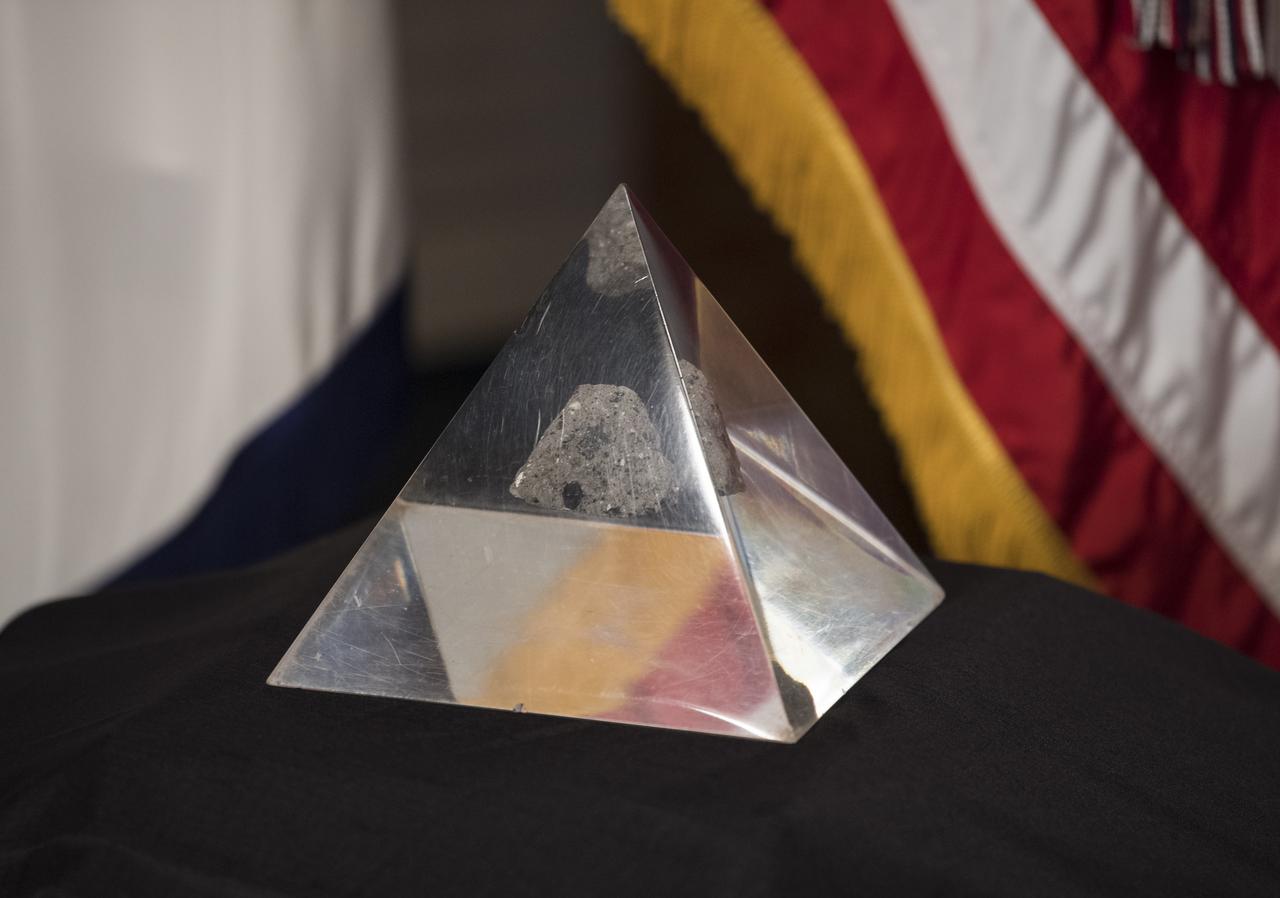 A moon rock collected by astronaut John Young during the Apollo 16 mission is seen before the swearing-in ceremony for former Senator Bill Nelson, as the 14th NASA Administrator, by Vice President Kamala Harris, Monday, May 3, 2021, at the Ceremonial Office in the Old Executive Office Building in Washington. Photo Credit: (NASA/Aubrey Gemignani)