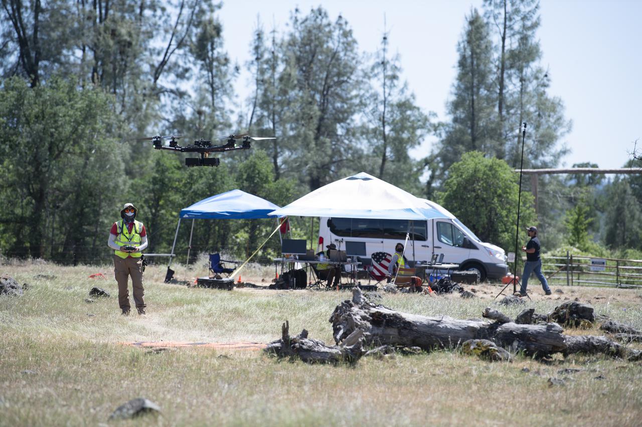 A FreeFly Systems Alta X drone is seen in flight during STEReO, the Scalable Traffic Management for Emergency Response Operations project, test activities, Tuesday, May 4, 2021 as Cal Fire conducts aerial fire fighting training exercises near Redding, California.  STEReO, the Scalable Traffic Management for Emergency Response Operations project, led by NASA’s Ames Research Center, builds on NASA’s expertise in air traffic management, human factors research, and autonomous technology development to apply the agency’s work in Unmanned Aircraft Systems Traffic Management, or UTM, to public safety uses. Photo Credit: (NASA/Joel Kowsky)
