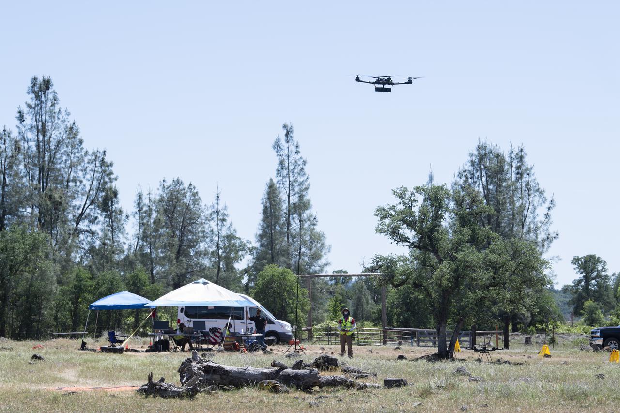 A FreeFly Systems Alta X drone is seen in flight during STEReO, the Scalable Traffic Management for Emergency Response Operations project, test activities, Tuesday, May 4, 2021 as Cal Fire conducts aerial fire fighting training exercises near Redding, California.  STEReO, the Scalable Traffic Management for Emergency Response Operations project, led by NASA’s Ames Research Center, builds on NASA’s expertise in air traffic management, human factors research, and autonomous technology development to apply the agency’s work in Unmanned Aircraft Systems Traffic Management, or UTM, to public safety uses. Photo Credit: (NASA/Joel Kowsky)