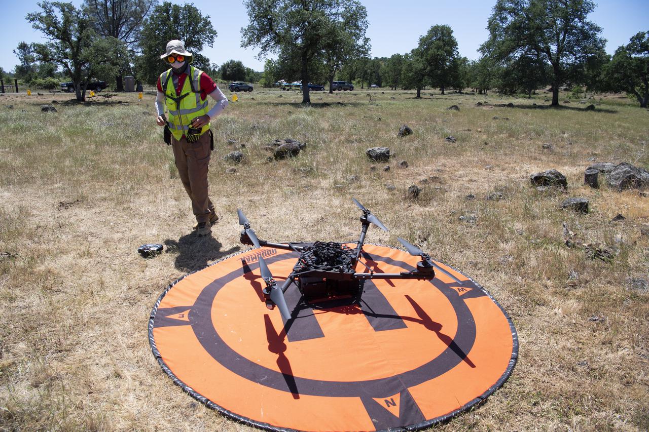 Jonas Jonsson, pilot in command for STEReO, the Scalable Traffic Management for Emergency Response Operations project, at NASA's Ames Research Center, is seen performing post-flight activities following the flight of a FreeFly Systems Alta X drone as part of STEReO test activities, Tuesday, May 4, 2021, as Cal Fire conducts aerial fire fighting training exercises near Redding, California. STEReO, the Scalable Traffic Management for Emergency Response Operations project, led by NASA’s Ames Research Center, builds on NASA’s expertise in air traffic management, human factors research, and autonomous technology development to apply the agency’s work in Unmanned Aircraft Systems Traffic Management, or UTM, to public safety uses. Photo Credit: (NASA/Joel Kowsky)