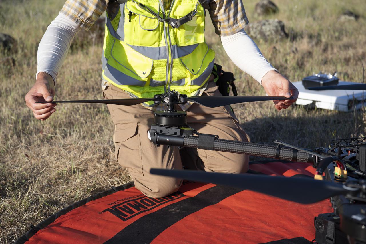 Jonas Jonsson, pilot in command for STEReO, the Scalable Traffic Management for Emergency Response Operations project, at NASA's Ames Research Center, performs pre-flight checks on a FreeFly Systems Alta X drone, Wednesday, May 5, 2021 as Cal Fire conducts aerial fire fighting training exercises near Redding, California.  STEReO, the Scalable Traffic Management for Emergency Response Operations project, led by NASA’s Ames Research Center, builds on NASA’s expertise in air traffic management, human factors research, and autonomous technology development to apply the agency’s work in Unmanned Aircraft Systems Traffic Management, or UTM, to public safety uses. Photo Credit: (NASA/Joel Kowsky)