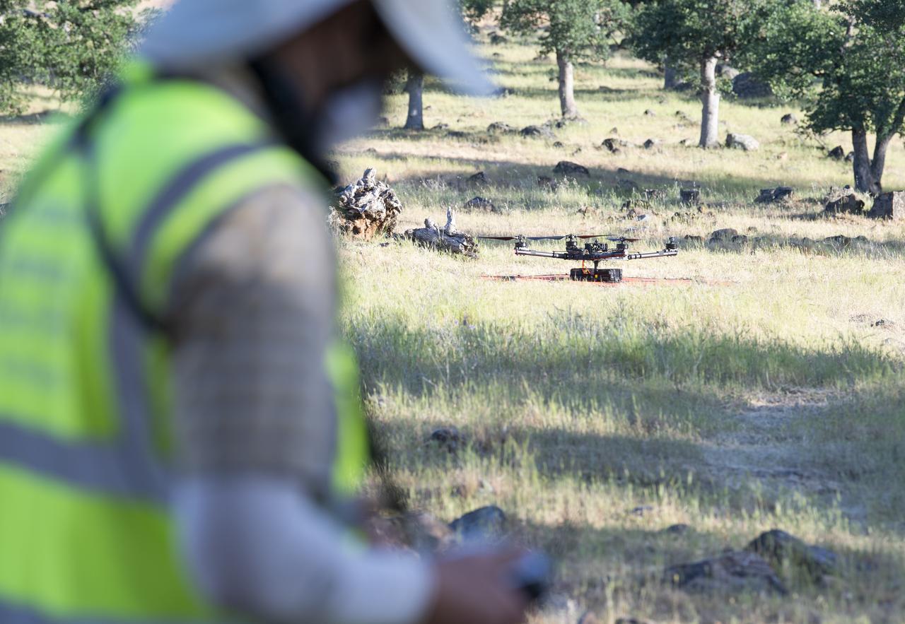 Jonas Jonsson, pilot in command for STEReO, the Scalable Traffic Management for Emergency Response Operations project, at NASA's Ames Research Center, performs pre-flight checks on a FreeFly Systems Alta X drone, Wednesday, May 5, 2021 as Cal Fire conducts aerial fire fighting training exercises near Redding, California.  STEReO, the Scalable Traffic Management for Emergency Response Operations project, led by NASA’s Ames Research Center, builds on NASA’s expertise in air traffic management, human factors research, and autonomous technology development to apply the agency’s work in Unmanned Aircraft Systems Traffic Management, or UTM, to public safety uses. Photo Credit: (NASA/Joel Kowsky)