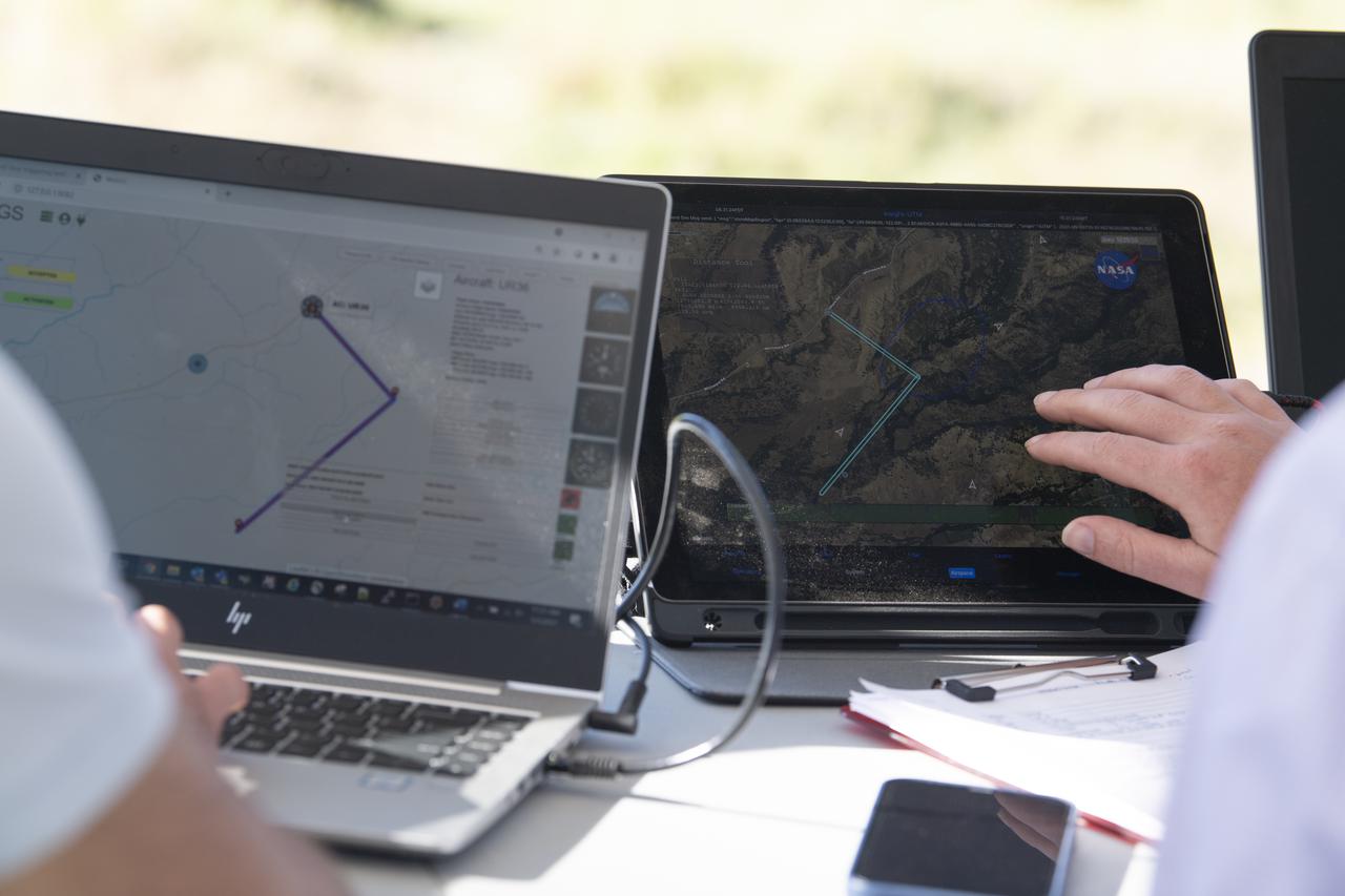 Bryan Petty, autonomy researcher for STEReO, the Scalable Traffic Management for Emergency Response Operations project, at NASA's Langley Research Center, left, and Robert McSwain, co-principle investigator and autonomy researcher for STEReO, the Scalable Traffic Management for Emergency Response Operations project, at NASA's Langley Research Center, right, are seen during simulated drone operations as part of STEReO field testing, Wednesday, May 5, 2021 as Cal Fire conducts aerial fire fighting training exercises near Redding, California.  STEReO, the Scalable Traffic Management for Emergency Response Operations project, led by NASA’s Ames Research Center, builds on NASA’s expertise in air traffic management, human factors research, and autonomous technology development to apply the agency’s work in Unmanned Aircraft Systems Traffic Management, or UTM, to public safety uses. Photo Credit: (NASA/Joel Kowsky)