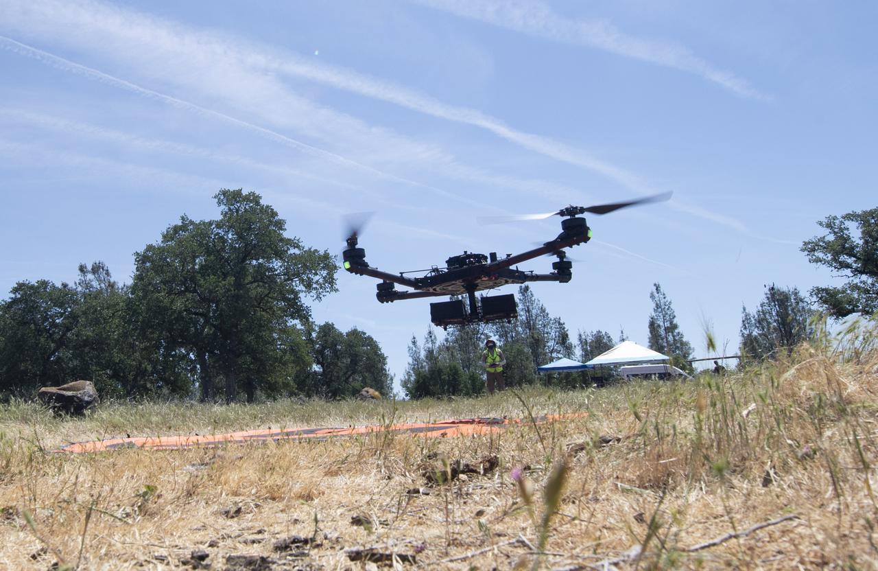 A FreeFly Systems Alta X drone is seen in flight under the control of Jonas Jonsson, pilot in command for STEReO, the Scalable Traffic Management for Emergency Response Operations project, at NASA's Ames Research Center, as part of STEReO test activities, Wednesday, May 5, 2021 as Cal Fire conducts aerial fire fighting training exercises near Redding, California. STEReO, the Scalable Traffic Management for Emergency Response Operations project, led by NASA’s Ames Research Center, builds on NASA’s expertise in air traffic management, human factors research, and autonomous technology development to apply the agency’s work in Unmanned Aircraft Systems Traffic Management, or UTM, to public safety uses. Photo Credit: (NASA/Joel Kowsky)