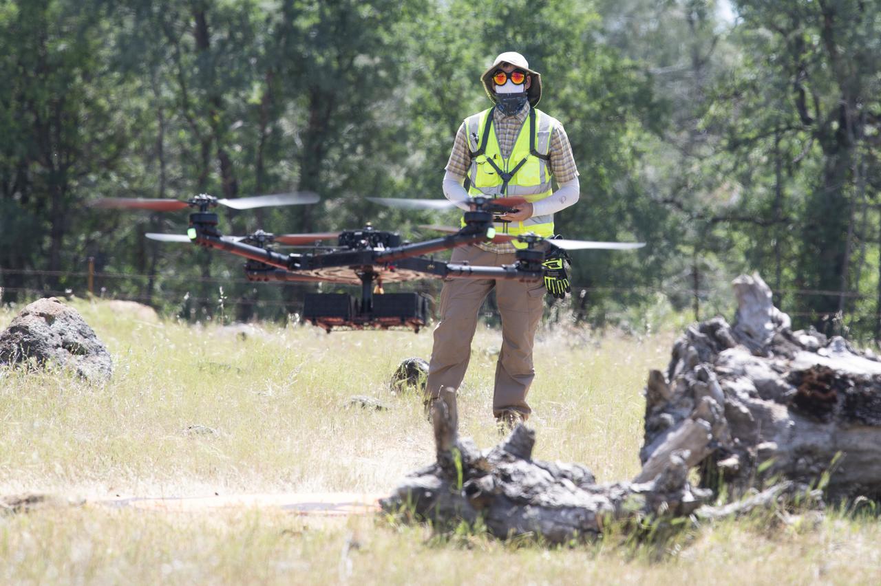 A FreeFly Systems Alta X drone is seen in flight under the control of Jonas Jonsson, pilot in command for STEReO, the Scalable Traffic Management for Emergency Response Operations project, at NASA's Ames Research Center, as part of STEReO test activities, Wednesday, May 5, 2021 as Cal Fire conducts aerial fire fighting training exercises near Redding, California. STEReO, the Scalable Traffic Management for Emergency Response Operations project, led by NASA’s Ames Research Center, builds on NASA’s expertise in air traffic management, human factors research, and autonomous technology development to apply the agency’s work in Unmanned Aircraft Systems Traffic Management, or UTM, to public safety uses. Photo Credit: (NASA/Joel Kowsky)