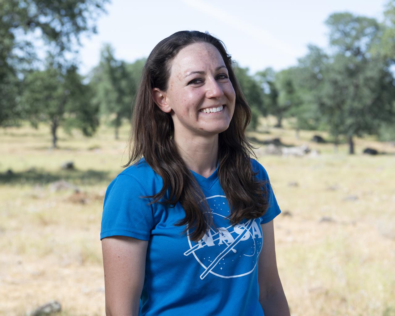 Lauren Claudatos, researcher for STEReO, the Scalable Traffic Management for Emergency Response Operations project, at NASA's Ames Research Center, poses for a portrait, Wednesday, May 5, 2021 as Cal Fire conducts aerial fire fighting training exercises near Redding, California.  STEReO, the Scalable Traffic Management for Emergency Response Operations project, led by NASA’s Ames Research Center, builds on NASA’s expertise in air traffic management, human factors research, and autonomous technology development to apply the agency’s work in Unmanned Aircraft Systems Traffic Management, or UTM, to public safety uses. Photo Credit: (NASA/Joel Kowsky)
