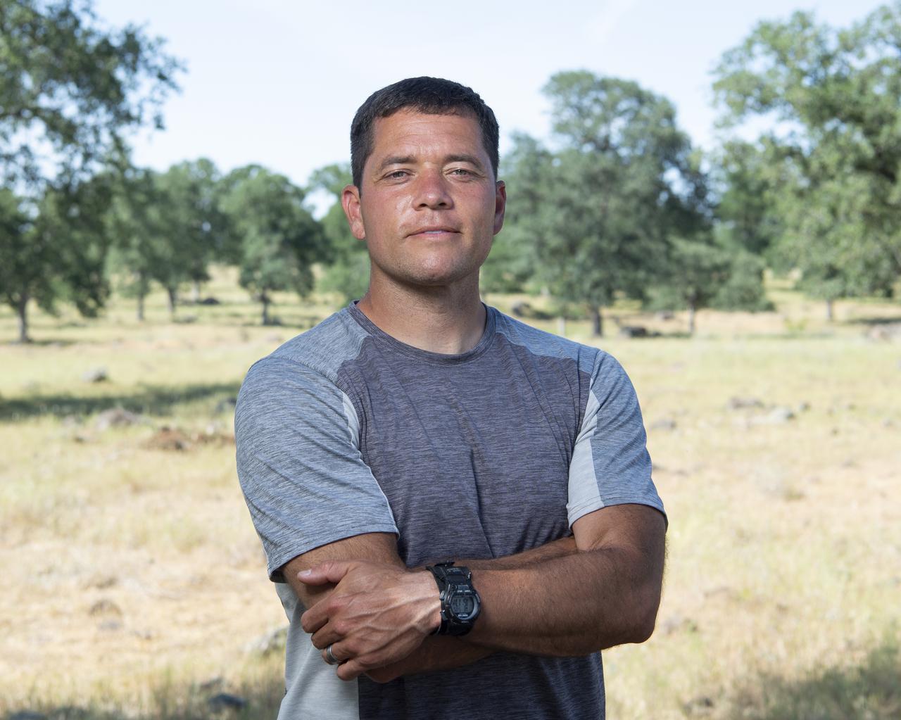Joey Mercer, principle investigator for STEReO, the Scalable Traffic Management for Emergency Response Operations project, at NASA's Ames Research Center, poses for a portrait, Wednesday, May 5, 2021 as Cal Fire conducts aerial fire fighting training exercises near Redding, California.  STEReO, the Scalable Traffic Management for Emergency Response Operations project, led by NASA’s Ames Research Center, builds on NASA’s expertise in air traffic management, human factors research, and autonomous technology development to apply the agency’s work in Unmanned Aircraft Systems Traffic Management, or UTM, to public safety uses. Photo Credit: (NASA/Joel Kowsky)