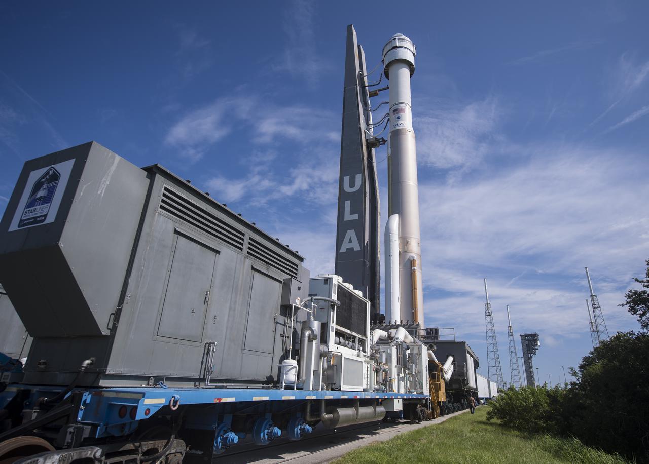 A United Launch Alliance Atlas V rocket with Boeing’s CST-100 Starliner spacecraft onboard is seen as it is rolled out of the Vertical Integration Facility to the launch pad at Space Launch Complex 41 ahead of the Orbital Flight Test-2 (OFT-2) mission, Thursday, July 29, 2021 at Cape Canaveral Space Force Station in Florida. Boeing’s Orbital Flight Test-2 will be Starliner’s second uncrewed flight test and will dock to the International Space Station as part of NASA's Commercial Crew Program. Photo Credit: (NASA/Aubrey Gemignani)