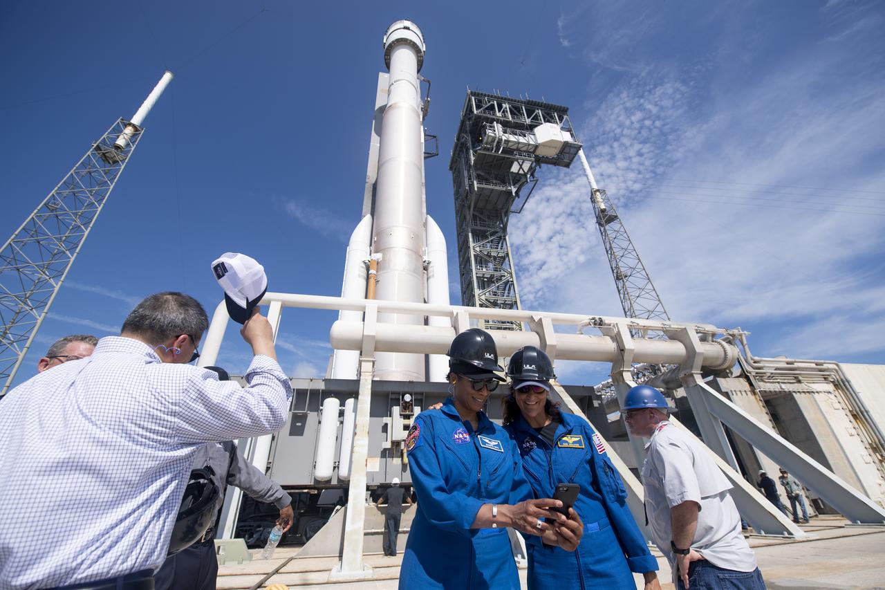 NASA astronauts Jeanette Epps, left, and Suni Williams, right, take a selfie as a United Launch Alliance Atlas V rocket with Boeing’s CST-100 Starliner spacecraft onboard is seen as it is rolled out of the Vertical Integration Facility to the launch pad at Space Launch Complex 41 ahead of the Orbital Flight Test-2 (OFT-2) mission, Thursday, July 29, 2021 at Cape Canaveral Space Force Station in Florida. Boeing’s Orbital Flight Test-2 will be Starliner’s second uncrewed flight test and will dock to the International Space Station as part of NASA's Commercial Crew Program. The mission, currently targeted for launch at 2:53 p.m. EDT Friday, July 30, will serve as an end-to-end test of the system's capabilities. Epps and Williams are assigned to fly on Starliner’s first operation mission. Photo Credit: (NASA/Joel Kowsky)