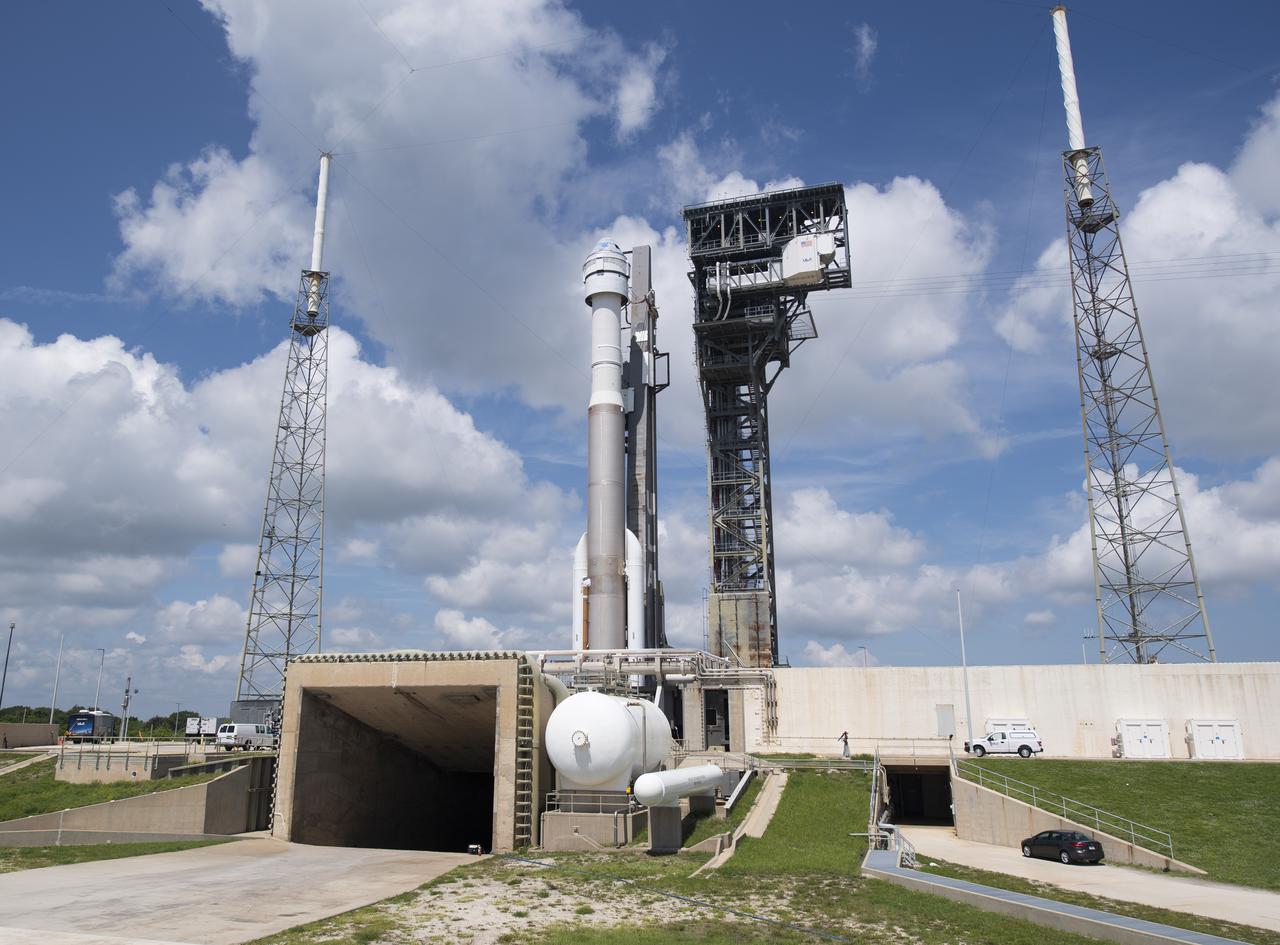 A United Launch Alliance Atlas V rocket with Boeing’s CST-100 Starliner spacecraft onboard is seen on the launch pad at Space Launch Complex 41 ahead of the Orbital Flight Test-2 (OFT-2) mission, Thursday, July 29, 2021 at Cape Canaveral Space Force Station in Florida. Boeing’s Orbital Flight Test-2 will be Starliner’s second uncrewed flight test and will dock to the International Space Station as part of NASA's Commercial Crew Program. The mission, currently targeted for launch at 2:53 p.m. EDT Friday, July 30, will serve as an end-to-end test of the system's capabilities. Photo Credit: (NASA/Joel Kowsky)