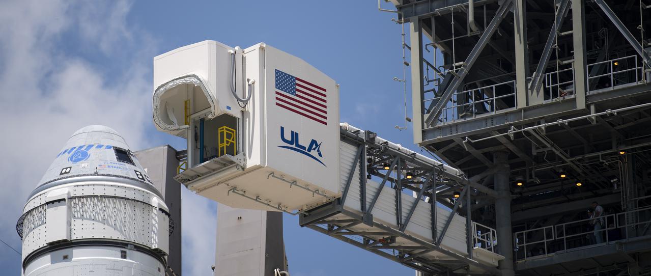 The crew access arm is seen as it swings into position for Boeing’s CST-100 Starliner spacecraft atop a United Launch Alliance Atlas V rocket at the launch pad at Space Launch Complex 41 ahead of the Orbital Flight Test-2 (OFT-2) mission, Thursday, July 29, 2021 at Cape Canaveral Space Force Station in Florida. Boeing’s Orbital Flight Test-2 will be Starliner’s second uncrewed flight test and will dock to the International Space Station as part of NASA's Commercial Crew Program. The mission, currently targeted for launch at 2:53 p.m. EDT Friday, July 30, will serve as an end-to-end test of the system's capabilities. Photo Credit: (NASA/Joel Kowsky)