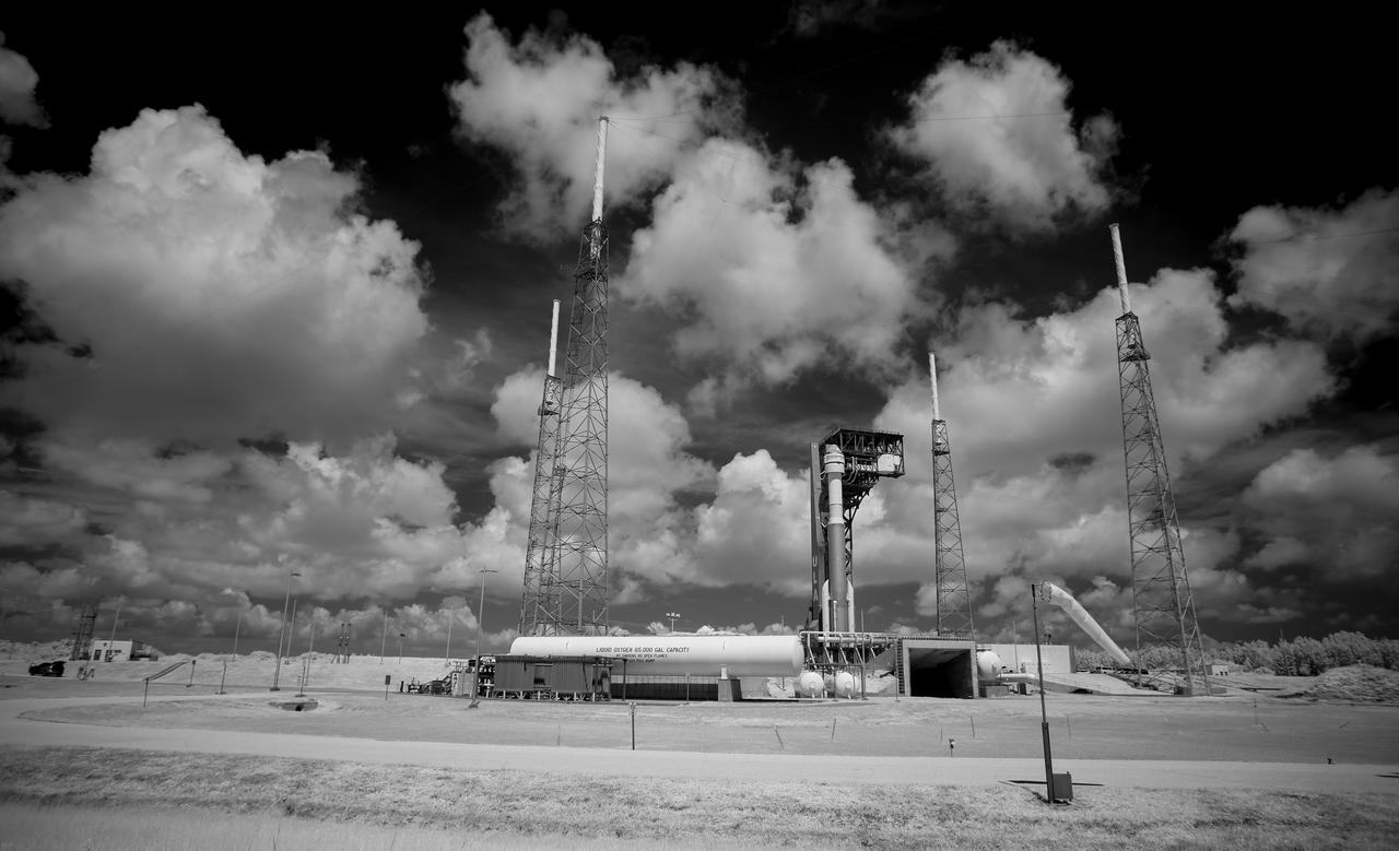 In this black and white infrared image, a United Launch Alliance Atlas V rocket with Boeing’s CST-100 Starliner spacecraft onboard is seen on the launch pad at Space Launch Complex 41 ahead of the Orbital Flight Test-2 mission, Thursday, July 29, 2021 at Cape Canaveral Space Force Station in Florida. Boeing’s Orbital Flight Test-2 will be Starliner’s second uncrewed flight test and will dock to the International Space Station as part of NASA's Commercial Crew Program. The mission will serve as an end-to-end test of the system's capabilities. Photo Credit: (NASA/Joel Kowsky)