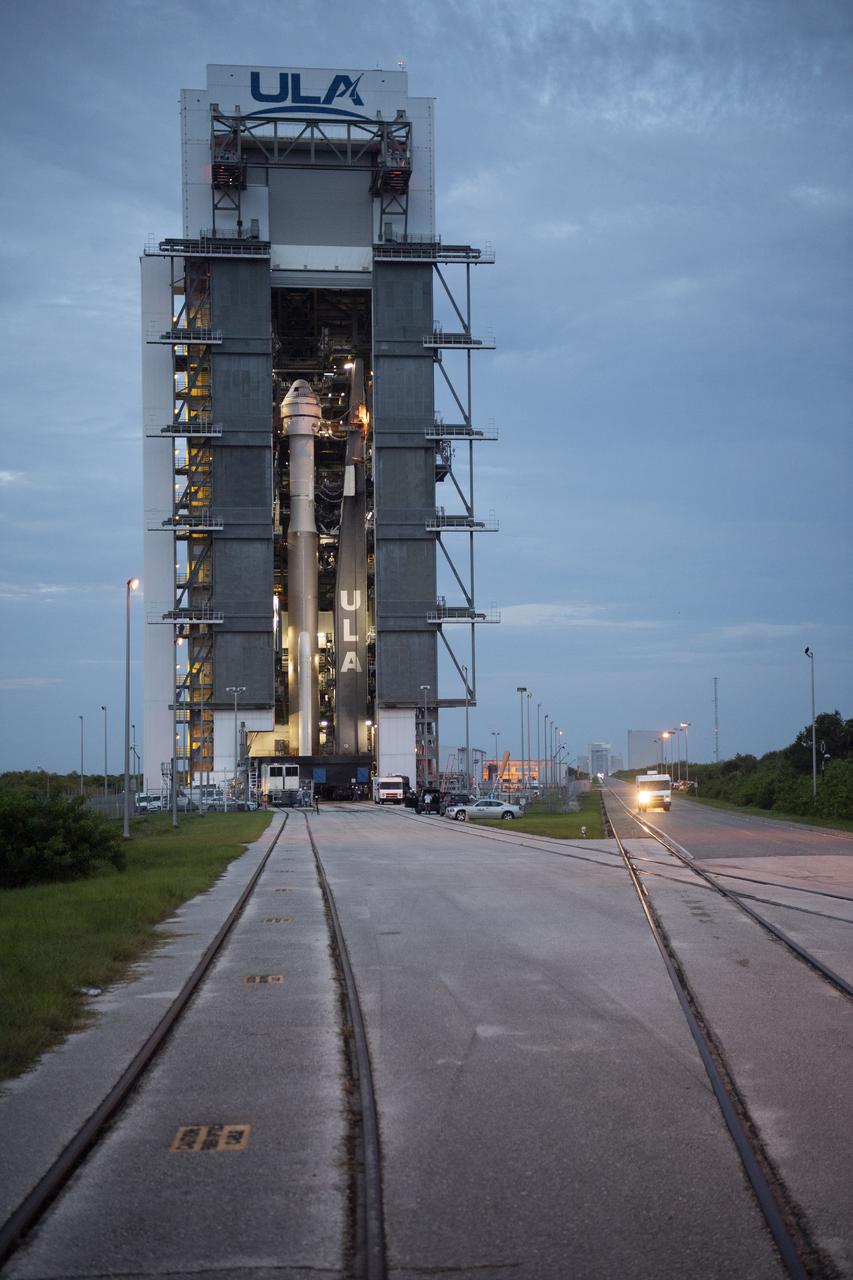 A United Launch Alliance Atlas V rocket with Boeing’s CST-100 Starliner spacecraft aboard is seen inside the Vertical Integration Facility prior to being rolled out to the launch pad at Space Launch Complex 41 ahead of the Orbital Flight Test-2 (OFT-2) mission, Monday, Aug. 2, 2021 at Cape Canaveral Space Force Station in Florida. Boeing’s Orbital Flight Test-2 will be Starliner’s second uncrewed flight test and will dock to the International Space Station as part of NASA's Commercial Crew Program. The mission, currently targeted for launch at 1:20 p.m. EDT Tuesday, Aug. 3, will serve as an end-to-end test of the system's capabilities. Photo Credit: (NASA/Joel Kowsky)