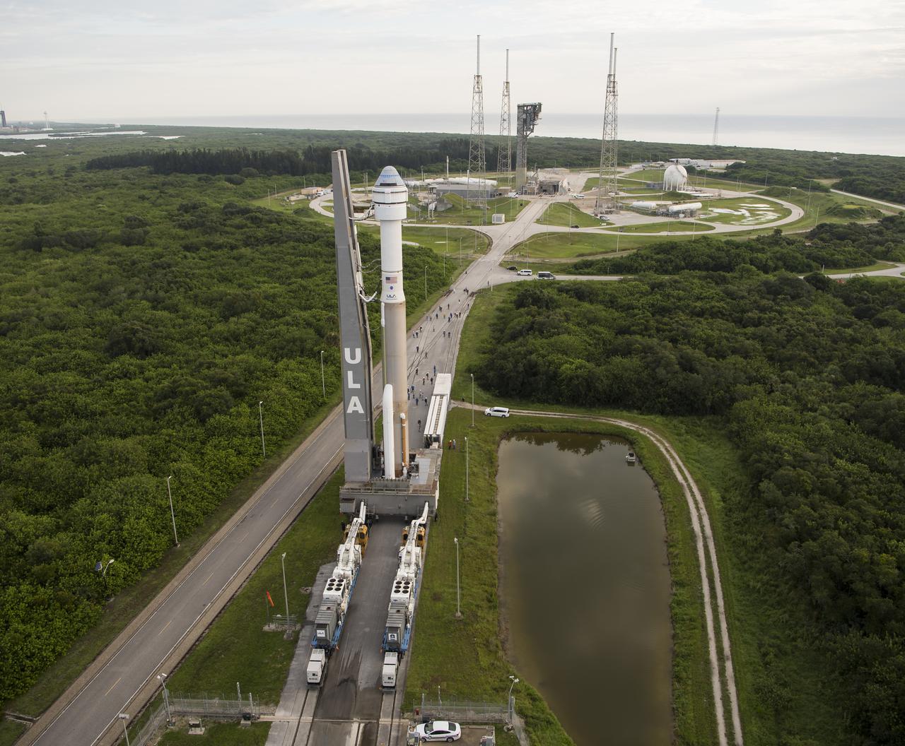 A United Launch Alliance Atlas V rocket with Boeing’s CST-100 Starliner spacecraft aboard is seen as it is rolled out of the Vertical Integration Facility to the launch pad at Space Launch Complex 41 ahead of the Orbital Flight Test-2 (OFT-2) mission, Monday, Aug. 2, 2021 at Cape Canaveral Space Force Station in Florida. Boeing’s Orbital Flight Test-2 will be Starliner’s second uncrewed flight test and will dock to the International Space Station as part of NASA's Commercial Crew Program. The mission, currently targeted for launch at 1:20 p.m. EDT Tuesday, Aug. 3, will serve as an end-to-end test of the system's capabilities. Photo Credit: (NASA/Aubrey Gemignani)