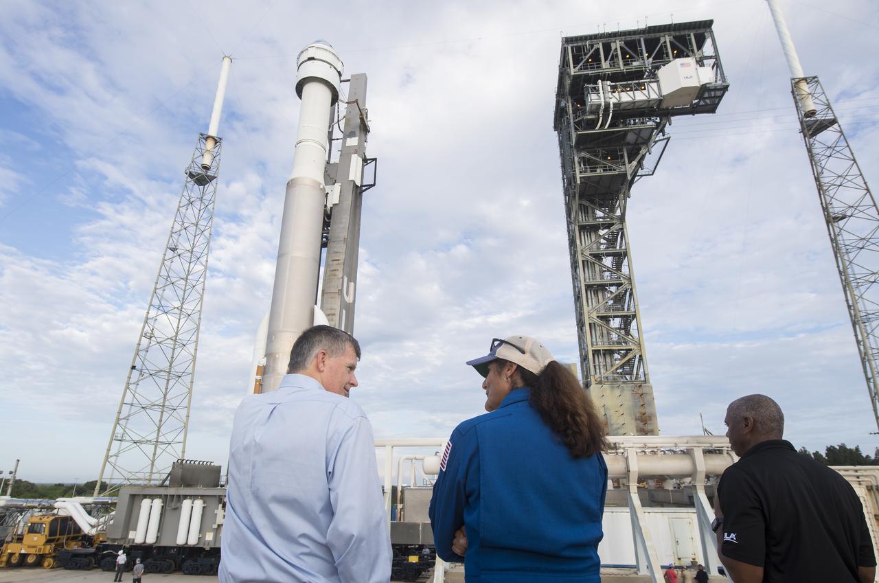 Steve Stich, manager of NASA’s Commercial Crew Program, left, and NASA astronaut Suni Williams, center, are seen as the United Launch Alliance Atlas V rocket with Boeing’s CST-100 Starliner spacecraft aboard is rolled out of the Vertical Integration Facility to the launch pad at Space Launch Complex 41 ahead of the Orbital Flight Test-2 (OFT-2) mission, Monday, Aug. 2, 2021 at Cape Canaveral Space Force Station in Florida. Boeing’s Orbital Flight Test-2 will be Starliner’s second uncrewed flight test and will dock to the International Space Station as part of NASA's Commercial Crew Program. The mission, currently targeted for launch at 1:20 p.m. EDT Tuesday, Aug. 3, will serve as an end-to-end test of the system's capabilities. Williams is scheduled to fly aboard Starliner’s first crew rotation mission. Photo Credit: (NASA/Aubrey Gemignani)