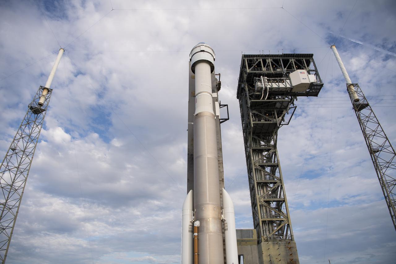 A United Launch Alliance Atlas V rocket with Boeing’s CST-100 Starliner spacecraft aboard is seen on the launch pad after it was rolled out of the Vertical Integration Facility to the launch pad at Space Launch Complex 41 ahead of the Orbital Flight Test-2 (OFT-2) mission, Monday, Aug. 2, 2021 at Cape Canaveral Space Force Station in Florida. Boeing’s Orbital Flight Test-2 will be Starliner’s second uncrewed flight test and will dock to the International Space Station as part of NASA's Commercial Crew Program. The mission, currently targeted for launch at 1:20 p.m. EDT Tuesday, Aug. 3, will serve as an end-to-end test of the system's capabilities. Photo Credit: (NASA/Aubrey Gemignani)