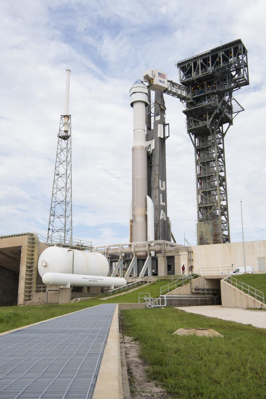 The crew access arm is seen as it swings into position for Boeing’s CST-100 Starliner spacecraft atop a United Launch Alliance Atlas V rocket at the launch pad at Space Launch Complex 41 ahead of the Orbital Flight Test-2 (OFT-2) mission, Monday, Aug. 2, 2021 at Cape Canaveral Space Force Station in Florida. Boeing’s Orbital Flight Test-2 will be Starliner’s second uncrewed flight test and will dock to the International Space Station as part of NASA's Commercial Crew Program. The mission, currently targeted for launch at 1:20 p.m. EDT Tuesday, Aug. 3, will serve as an end-to-end test of the system's capabilities. Photo Credit: (NASA/Aubrey Gemignani)