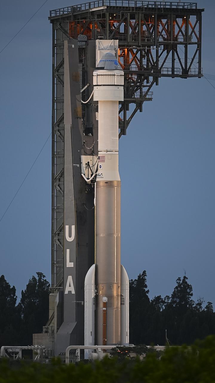 A United Launch Alliance Atlas V rocket with Boeing’s CST-100 Starliner spacecraft aboard is seen on the launch pad at Space Launch Complex 41 ahead of the Orbital Flight Test-2 mission, Monday, Aug. 2, 2021 at Cape Canaveral Space Force Station in Florida. Boeing’s Orbital Flight Test-2 will be Starliner’s second uncrewed flight test and will dock to the International Space Station as part of NASA's Commercial Crew Program. The mission, currently targeted for launch at 1:20 p.m. EDT Tuesday, Aug. 3, will serve as an end-to-end test of the system's capabilities. Photo Credit: (NASA/Aubrey Gemignani)