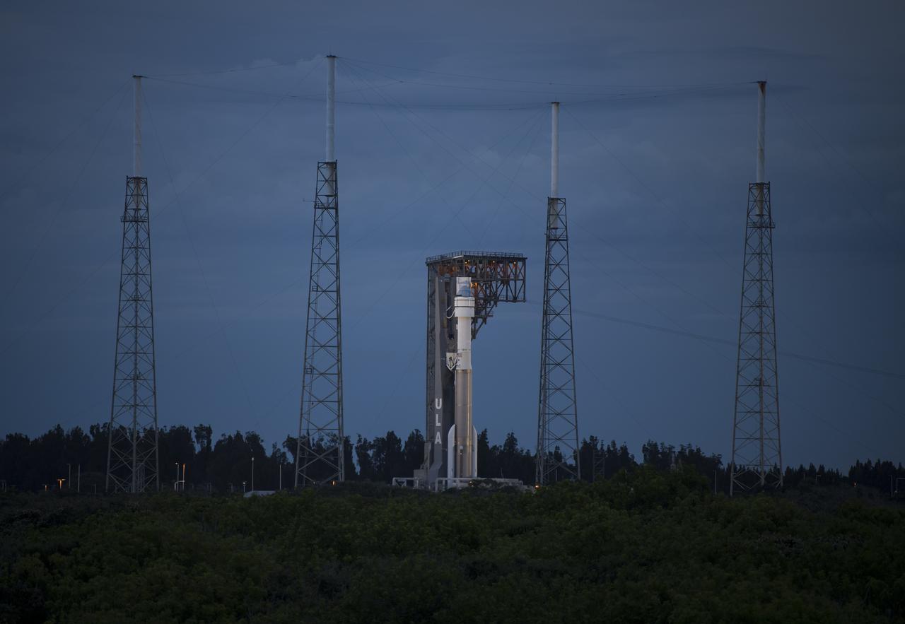 A United Launch Alliance Atlas V rocket with Boeing’s CST-100 Starliner spacecraft aboard is seen on the launch pad at Space Launch Complex 41 ahead of the Orbital Flight Test-2 mission, Monday, Aug. 2, 2021 at Cape Canaveral Space Force Station in Florida. Boeing’s Orbital Flight Test-2 will be Starliner’s second uncrewed flight test and will dock to the International Space Station as part of NASA's Commercial Crew Program. The mission, currently targeted for launch at 1:20 p.m. EDT Tuesday, Aug. 3, will serve as an end-to-end test of the system's capabilities. Photo Credit: (NASA/Aubrey Gemignani)