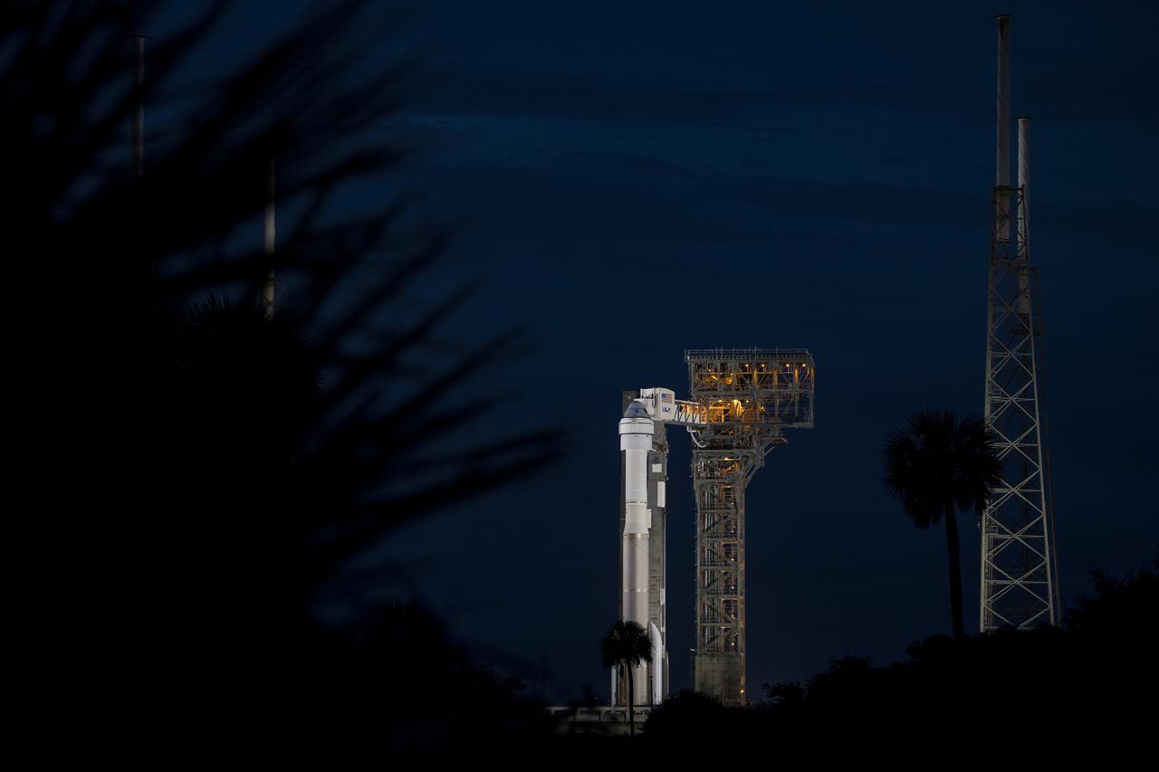 A United Launch Alliance Atlas V rocket with Boeing’s CST-100 Starliner spacecraft aboard is seen on the launch pad at Space Launch Complex 41 ahead of the Orbital Flight Test-2 mission, Monday, Aug. 2, 2021 at Cape Canaveral Space Force Station in Florida. Boeing’s Orbital Flight Test-2 will be Starliner’s second uncrewed flight test and will dock to the International Space Station as part of NASA's Commercial Crew Program. The mission, currently targeted for launch at 1:20 p.m. EDT Tuesday, Aug. 3, will serve as an end-to-end test of the system's capabilities. Photo Credit: (NASA/Aubrey Gemignani)