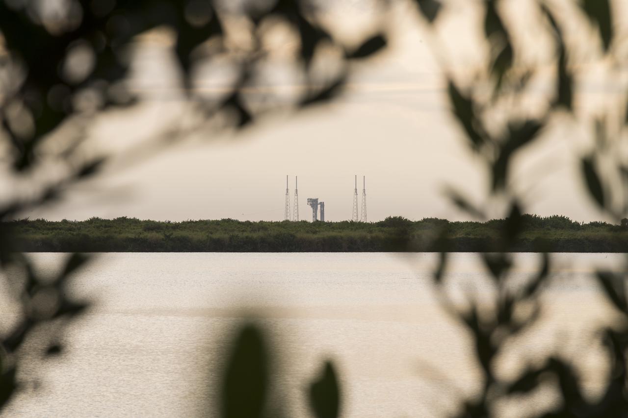 A United Launch Alliance Atlas V rocket with Boeing’s CST-100 Starliner spacecraft aboard is seen at sunrise on the launch pad at Space Launch Complex 41 ahead of the Orbital Flight Test-2 mission, Tuesday, Aug. 3, 2021 at Cape Canaveral Space Force Station in Florida. Boeing’s Orbital Flight Test-2 will be Starliner’s second uncrewed flight test and will dock to the International Space Station as part of NASA's Commercial Crew Program. The mission, currently targeted for launch at 1:20 p.m. EDT, will serve as an end-to-end test of the system's capabilities. Photo Credit: (NASA/Aubrey Gemignani)