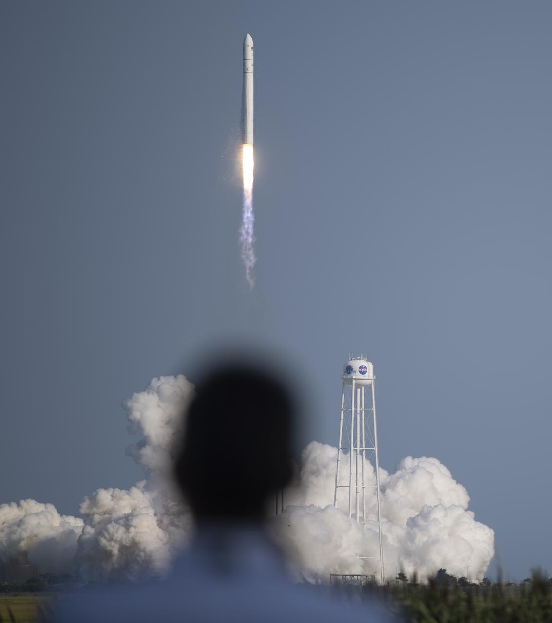 A Northrop Grumman Antares rocket carrying a Cygnus resupply spacecraft launches from  Pad-0A of the Mid-Atlantic Regional Spaceport, Tuesday, Aug. 10, 2021, at NASA's Wallops Flight Facility in Virginia. Northrop Grumman’s 16th contracted cargo resupply mission with NASA will deliver nearly 8,200 pounds of science and research, crew supplies and vehicle hardware to the International Space Station and its crew.  Photo Credit: (NASA/Joel Kowsky)