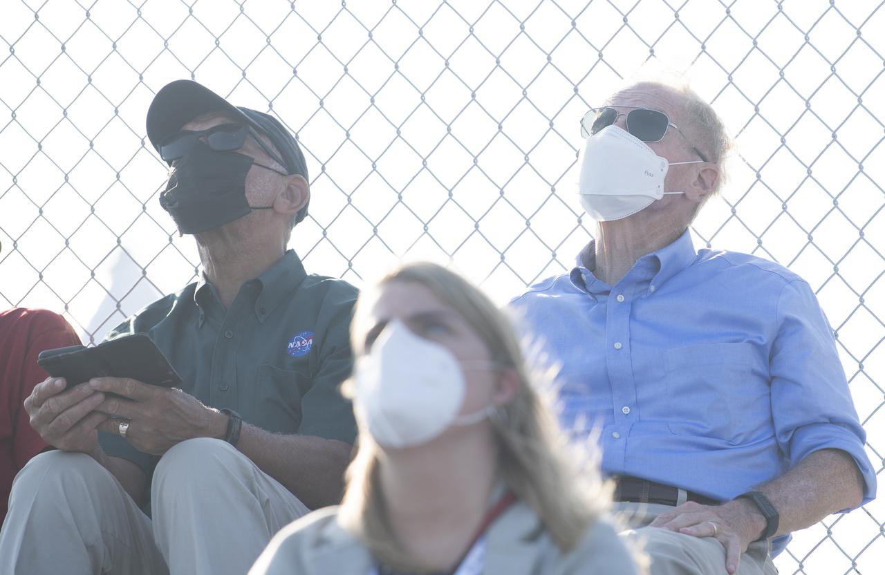 NASA Administrator Bill Nelson, right, and former NASA Administrator Charles Bolden, left, watch as a Northrop Grumman Antares rocket carrying a Cygnus resupply spacecraft launches from  Pad-0A of the Mid-Atlantic Regional Spaceport, Tuesday, Aug. 10, 2021, at NASA's Wallops Flight Facility in Virginia. Northrop Grumman’s 16th contracted cargo resupply mission with NASA will deliver nearly 8,200 pounds of science and research, crew supplies and vehicle hardware to the International Space Station and its crew.  Photo Credit: (NASA/Joel Kowsky}